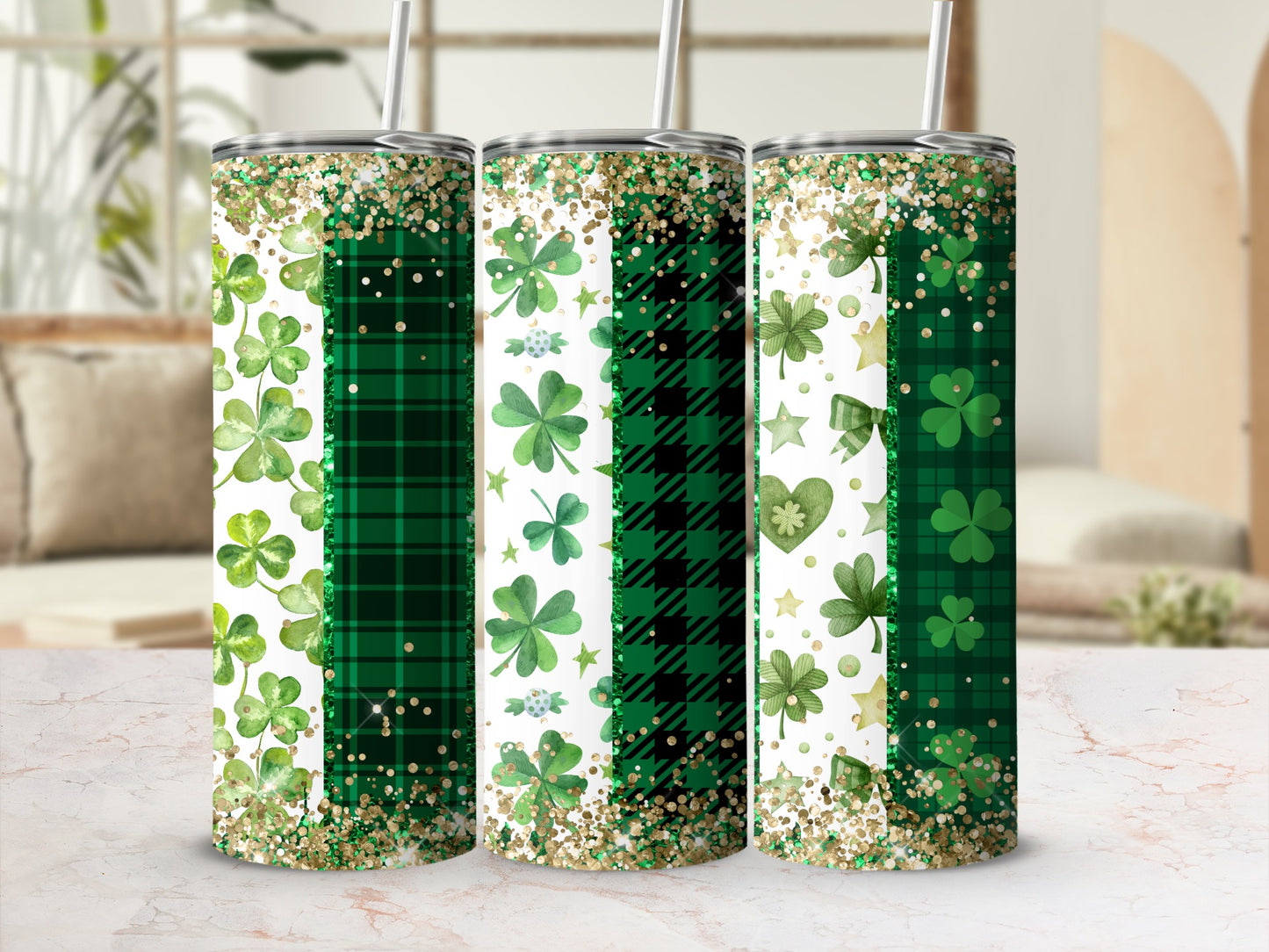 Three green tumblers with shamrocks, plaid patterns, and glitter.