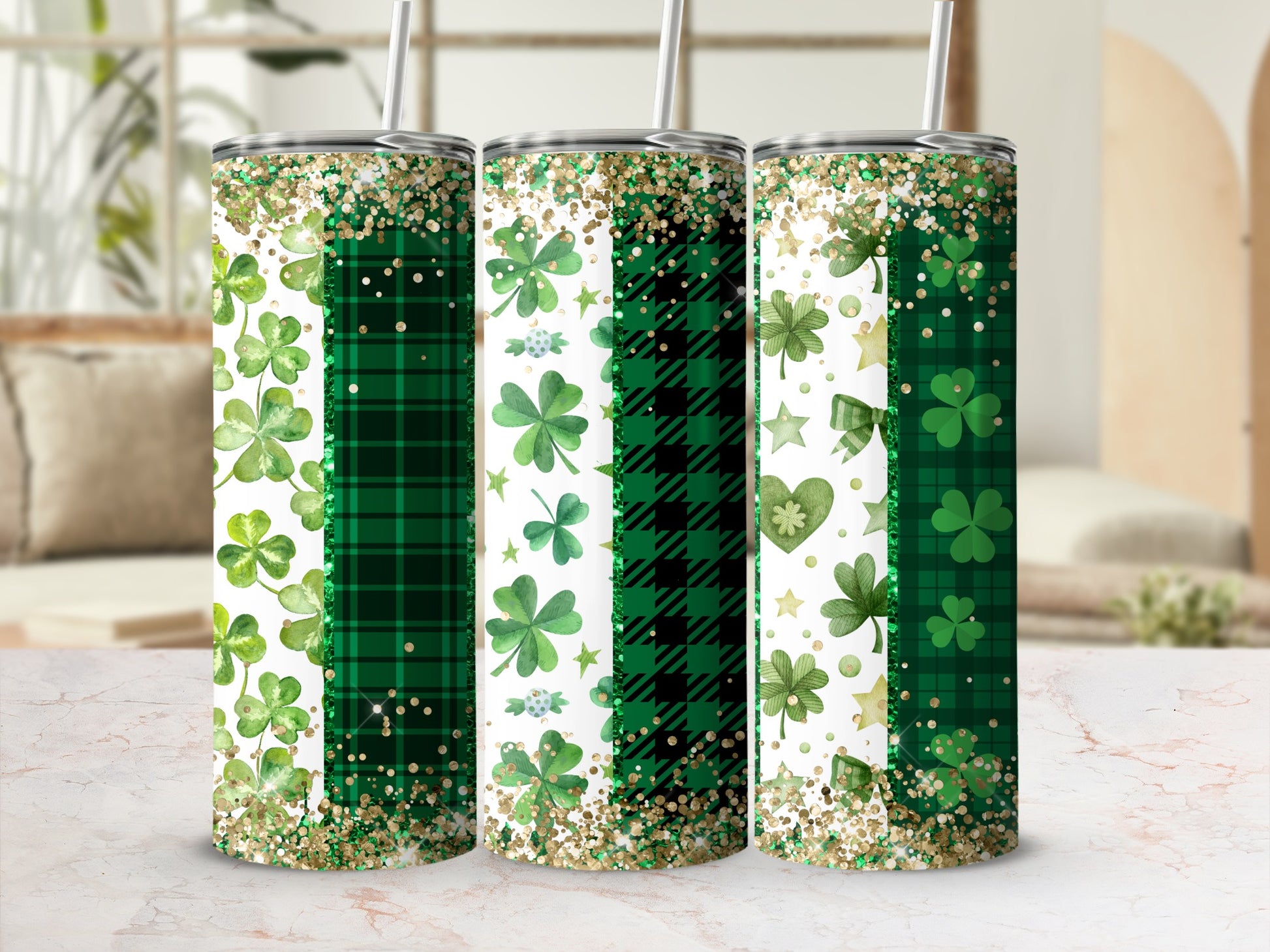 Three green tumblers with shamrocks, plaid patterns, and glitter.