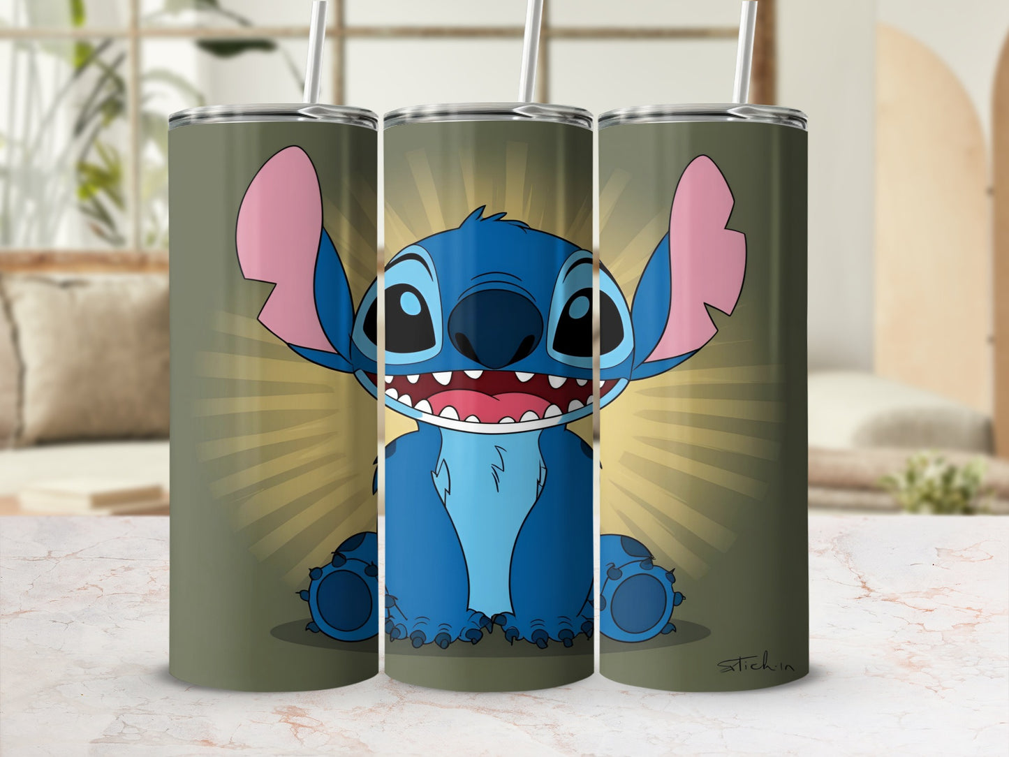 Blue Stitch character with wide smile and big ears on a green patterned tumbler.