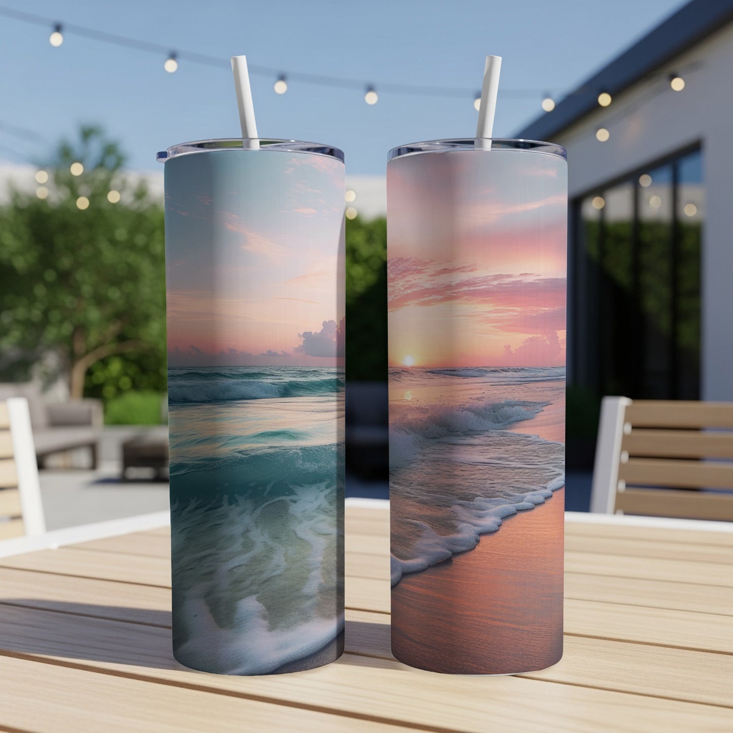 Two tumblers featuring ocean waves and sunset on a table.