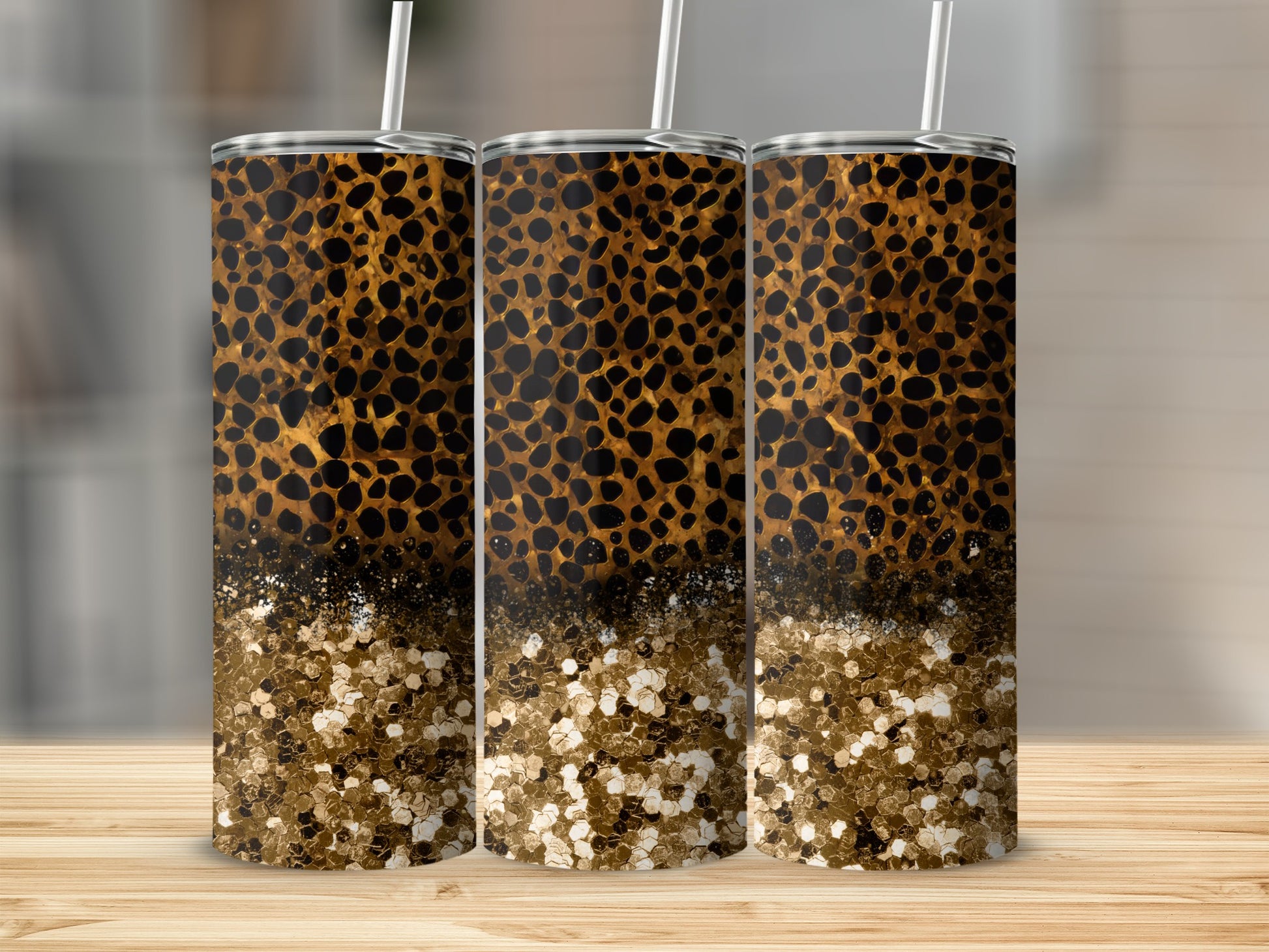 Leopard print tumbler with gold glitter bottom and straw.