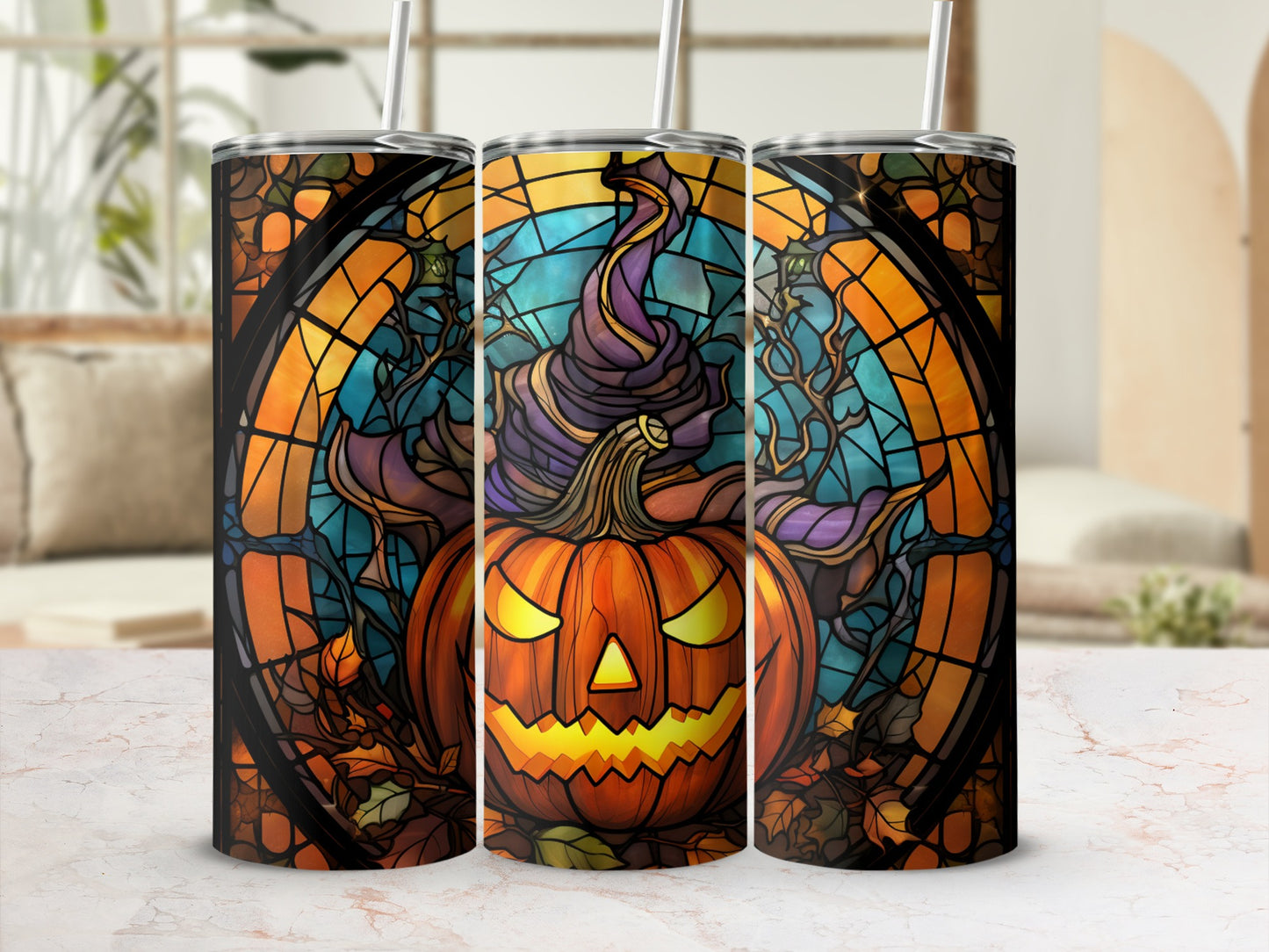 Three Halloween-themed tumblers featuring a jack-o'-lantern in a witch hat.