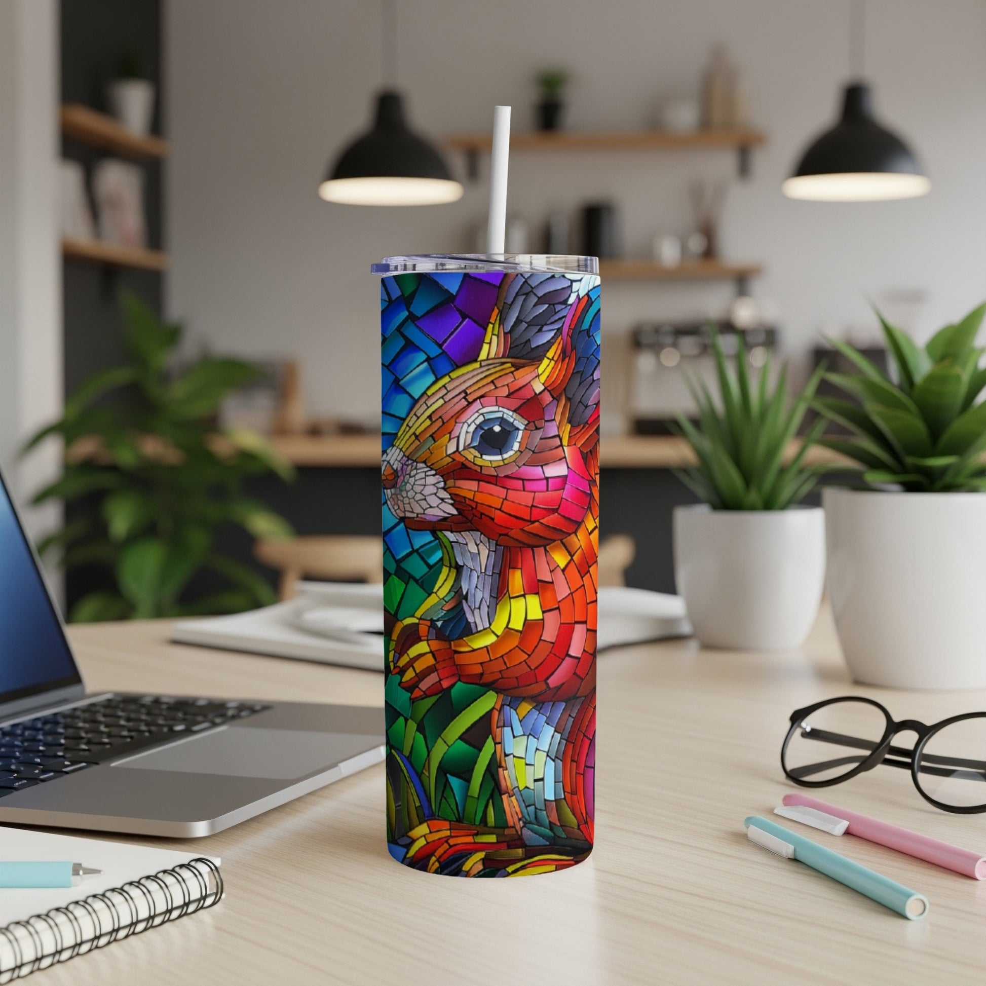 Stained glass squirrel design on a skinny tumbler with a straw.