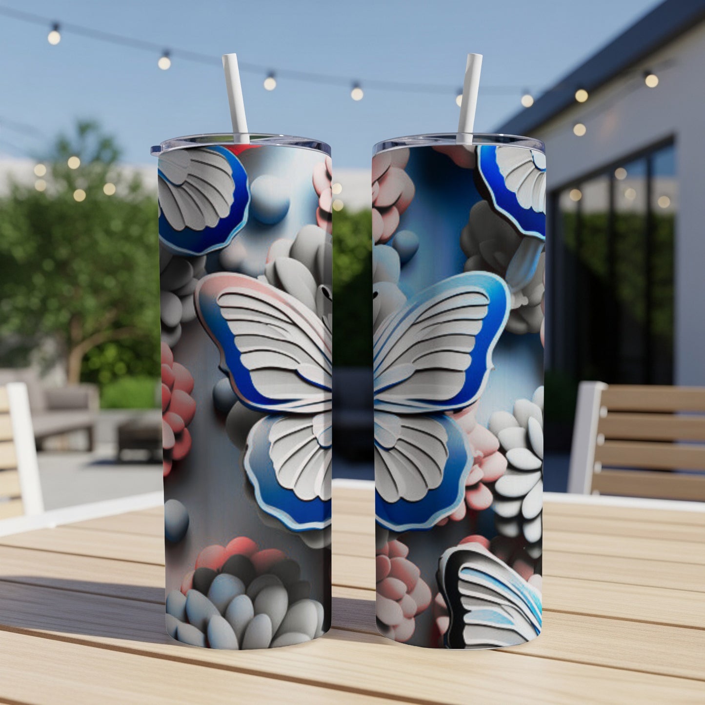 Two tumblers with a blue and white butterfly and floral design.