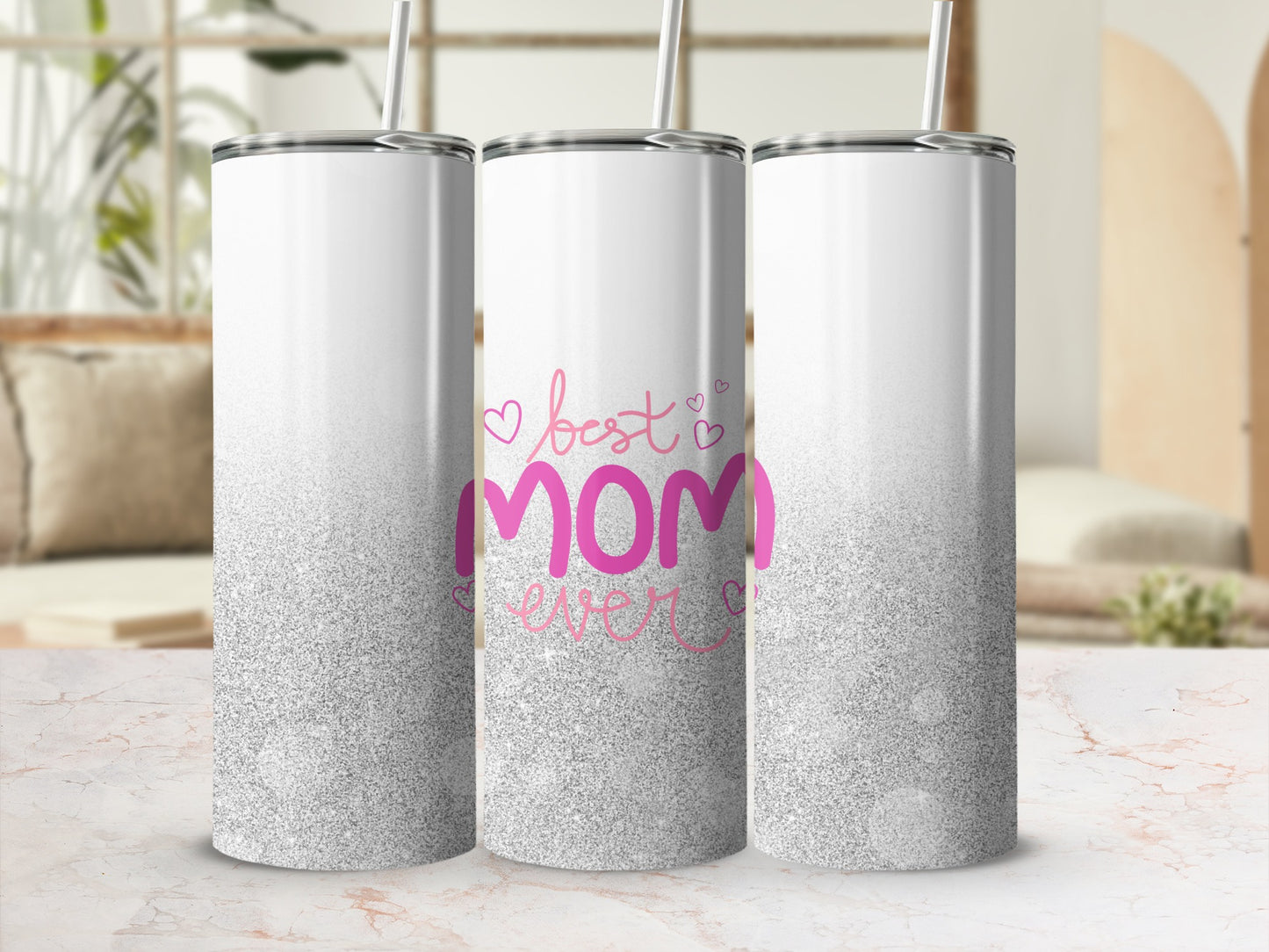 Three white tumblers with pink glitter fade and "best mom ever" text.