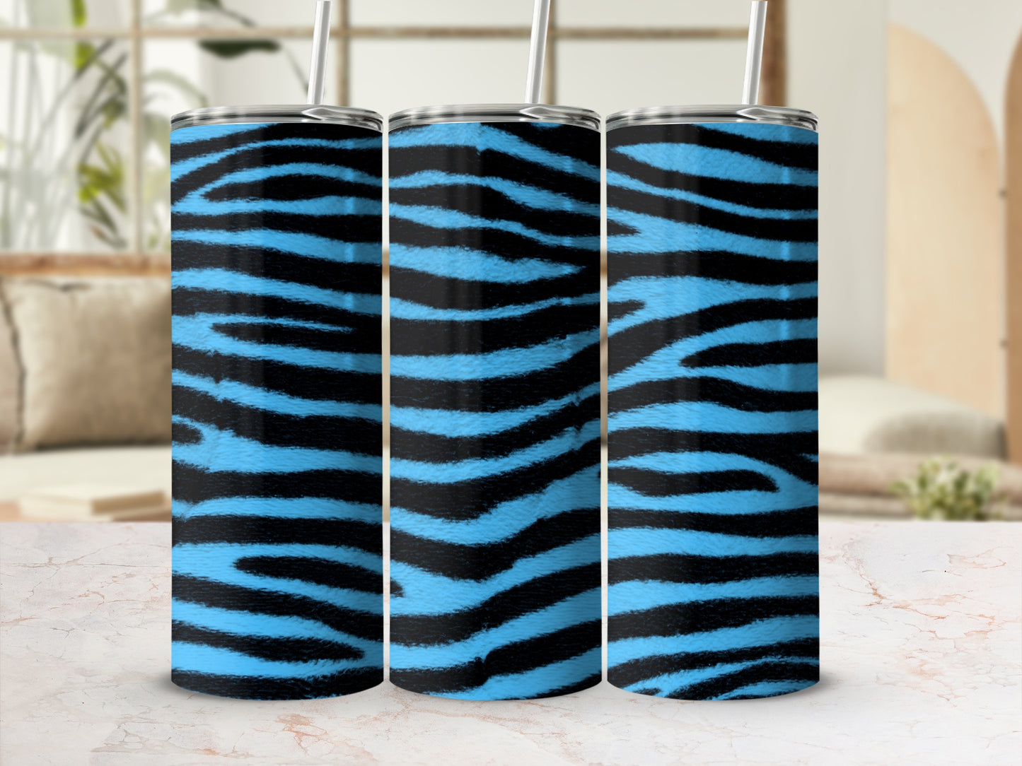 Three tumblers with blue and black tiger stripe pattern and silver lids.