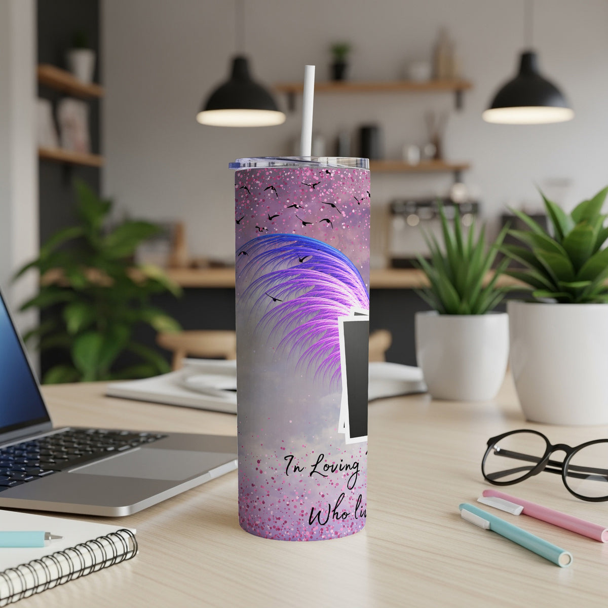 Purple glitter tumbler with abstract feathers, birds, and text that reads "In Loving Who Li".
