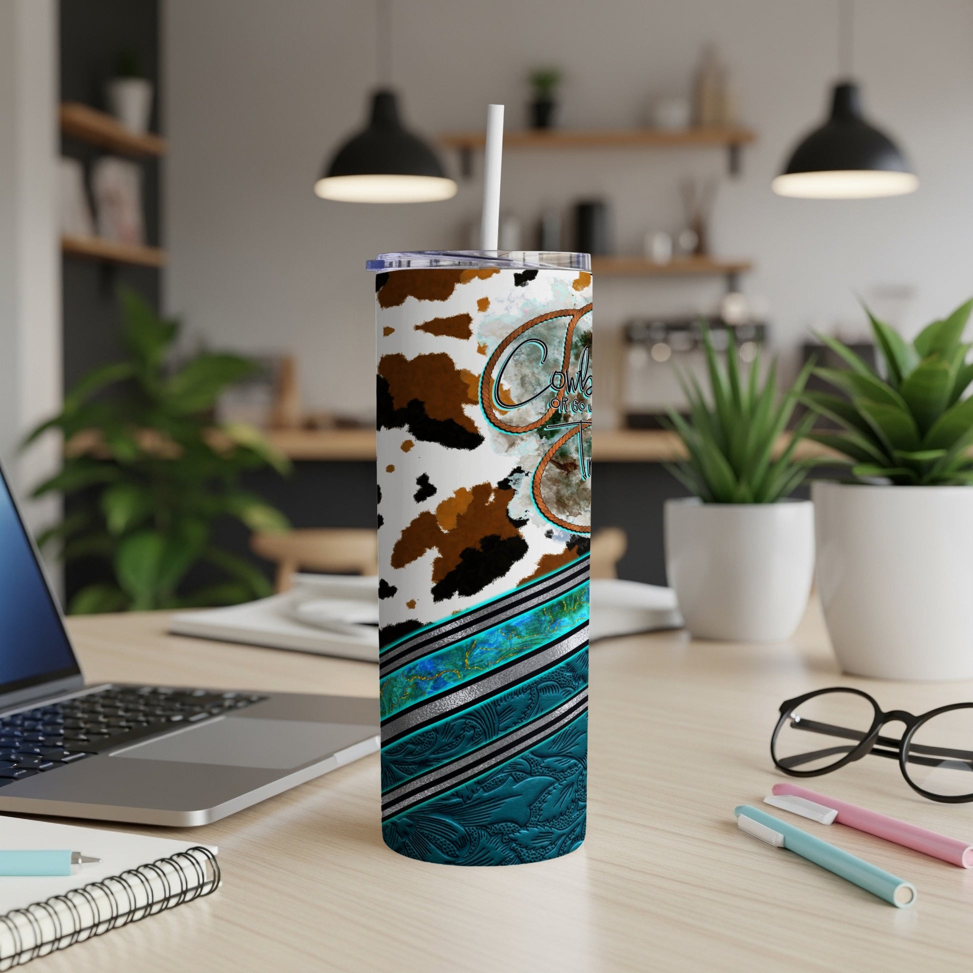 Cowboy hat and boots tumbler with turquoise and cow print design.