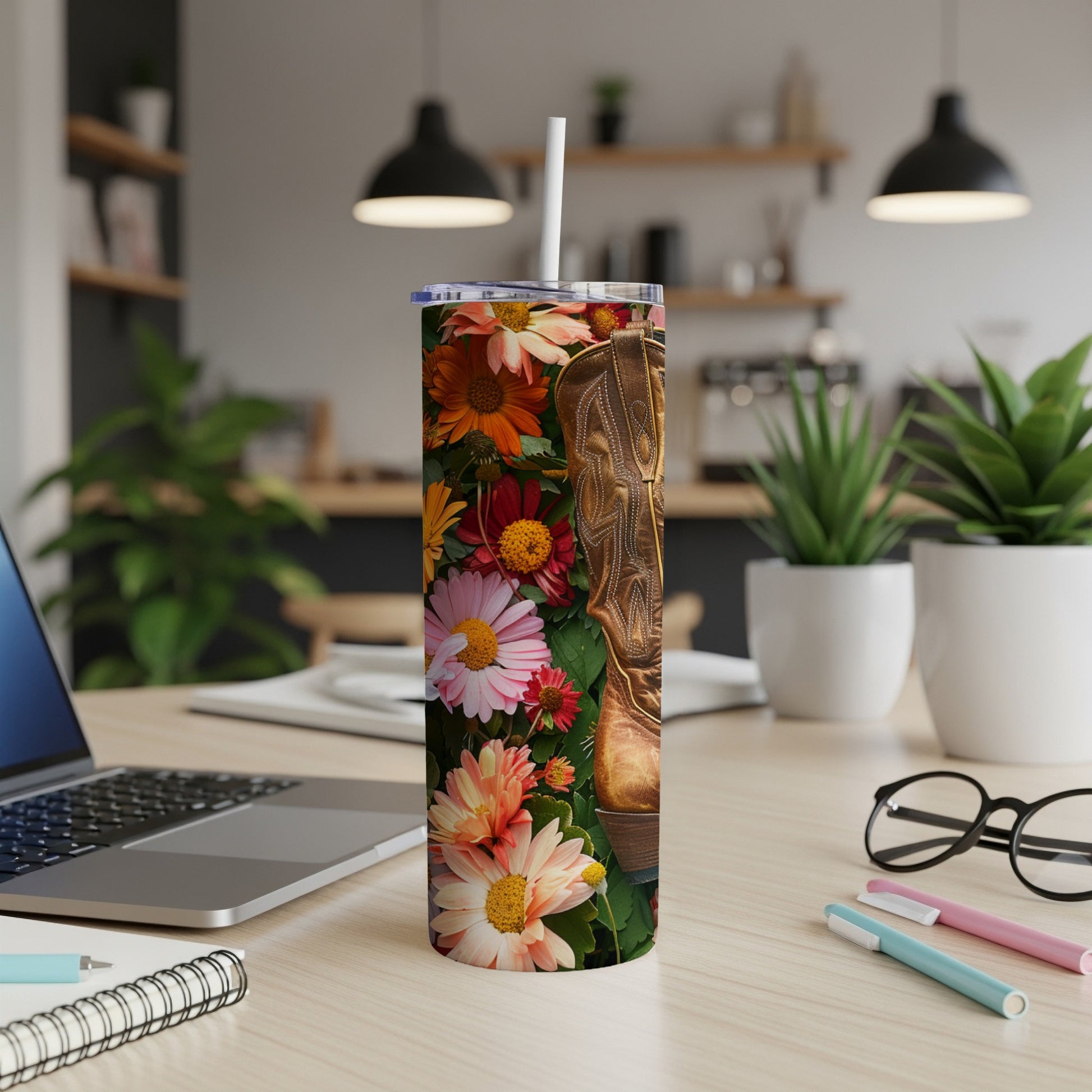 Cowboy boot with colorful floral pattern on a tumbler.
