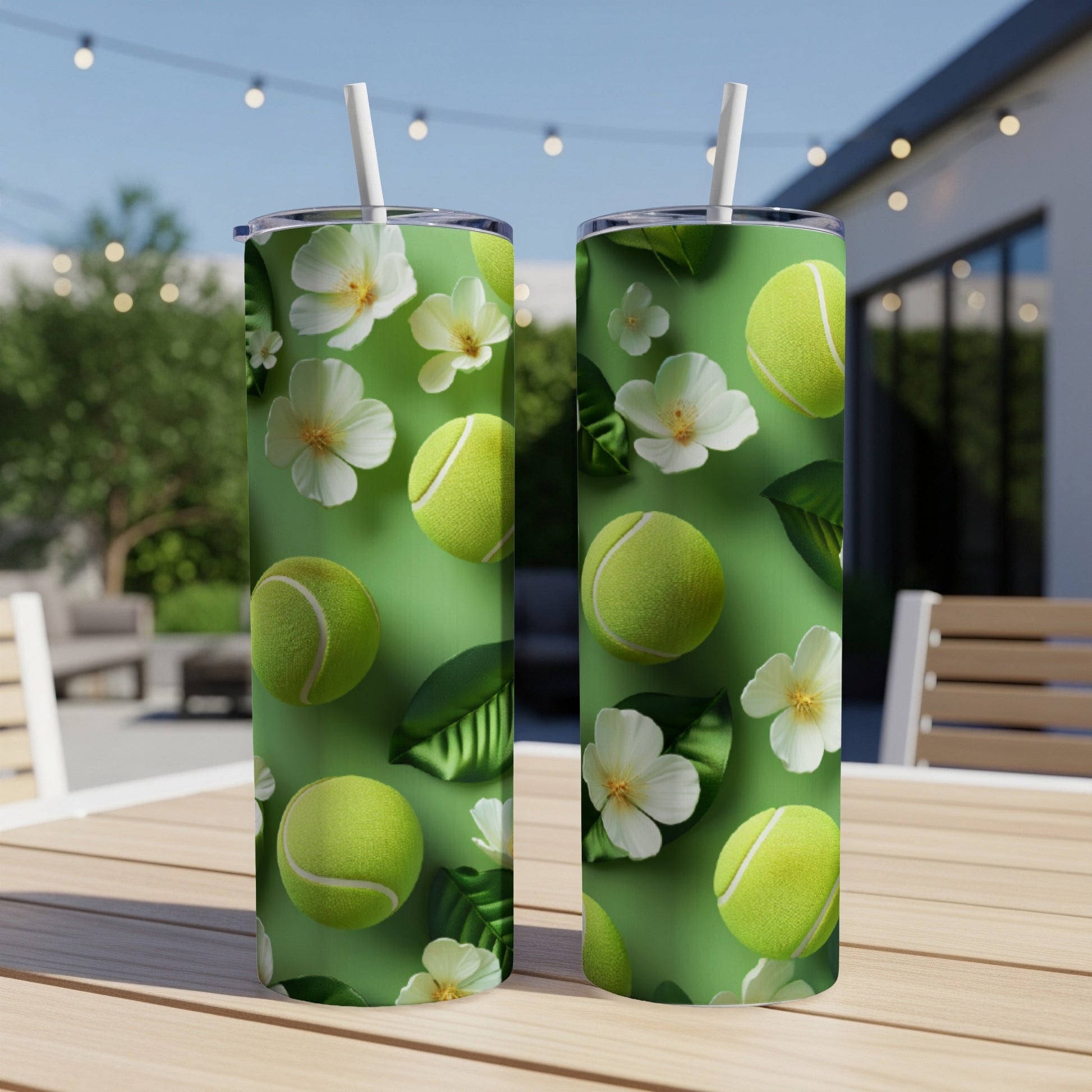 Green tumbler with tennis balls and white flowers pattern.