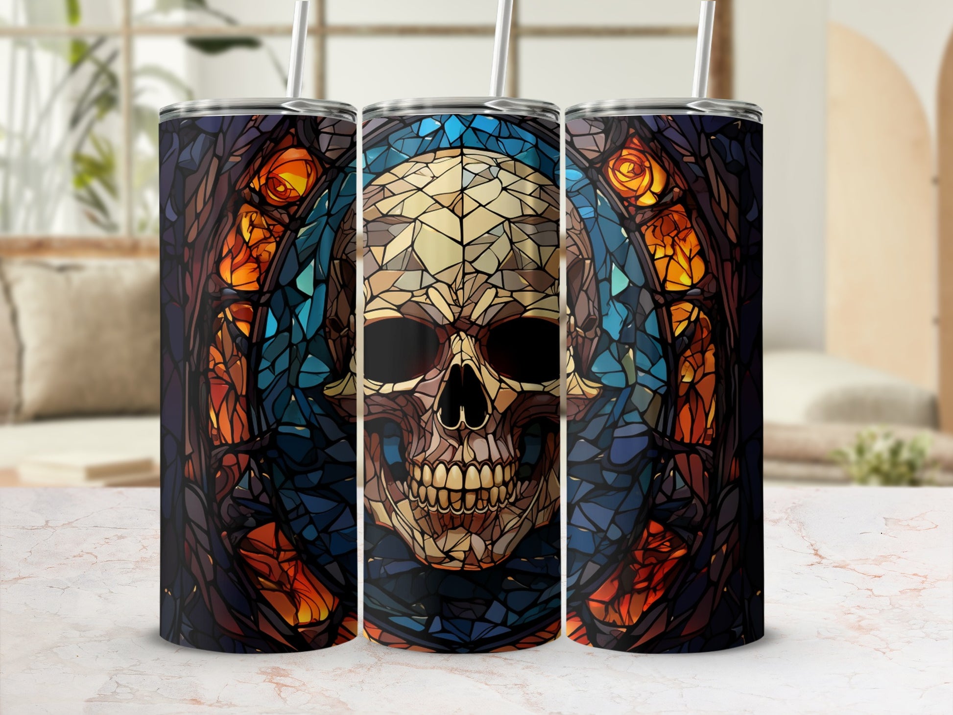 Three tall tumblers with stained-glass skull designs.