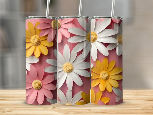 Three pink and white daisy tumblers with yellow centers on a wooden surface.