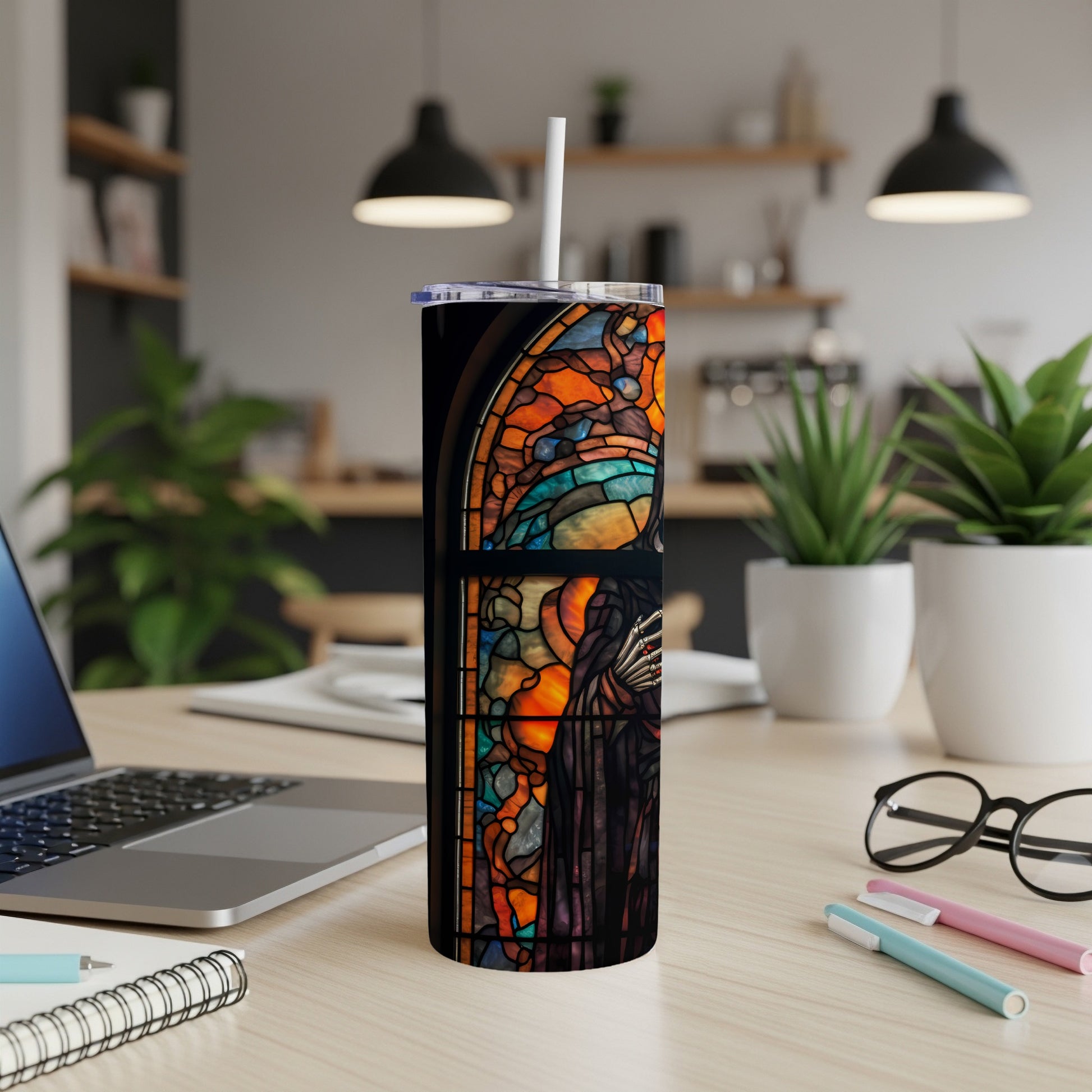 Stained glass-style tumbler featuring a dark figure against a window.