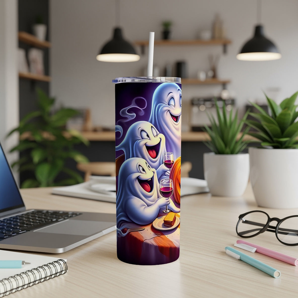 Tumbler with three cheerful ghosts celebrating with wine and cake.
