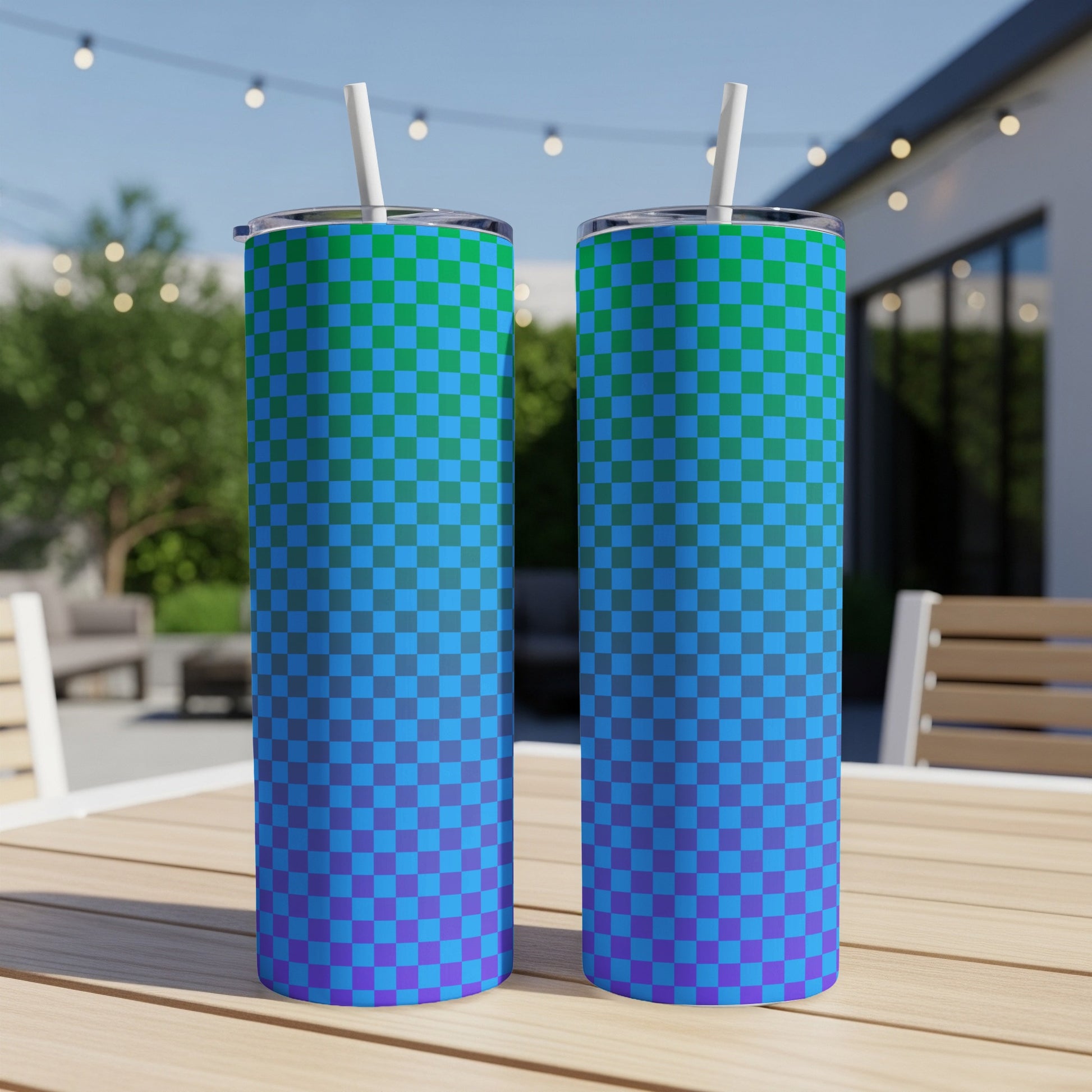 Two tumblers with a blue and green checkered gradient pattern sit on a table.