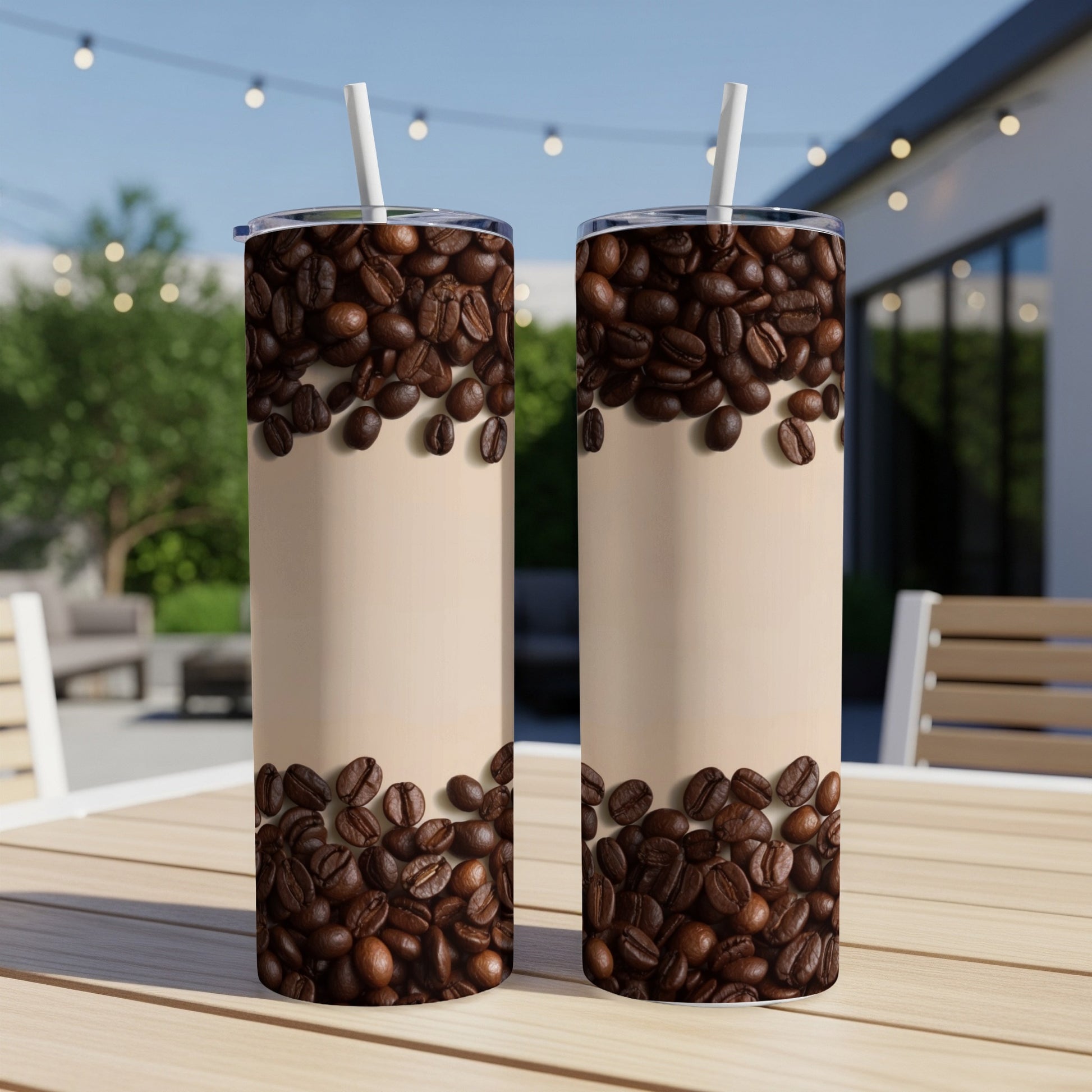Two tumblers with coffee bean pattern on a table.