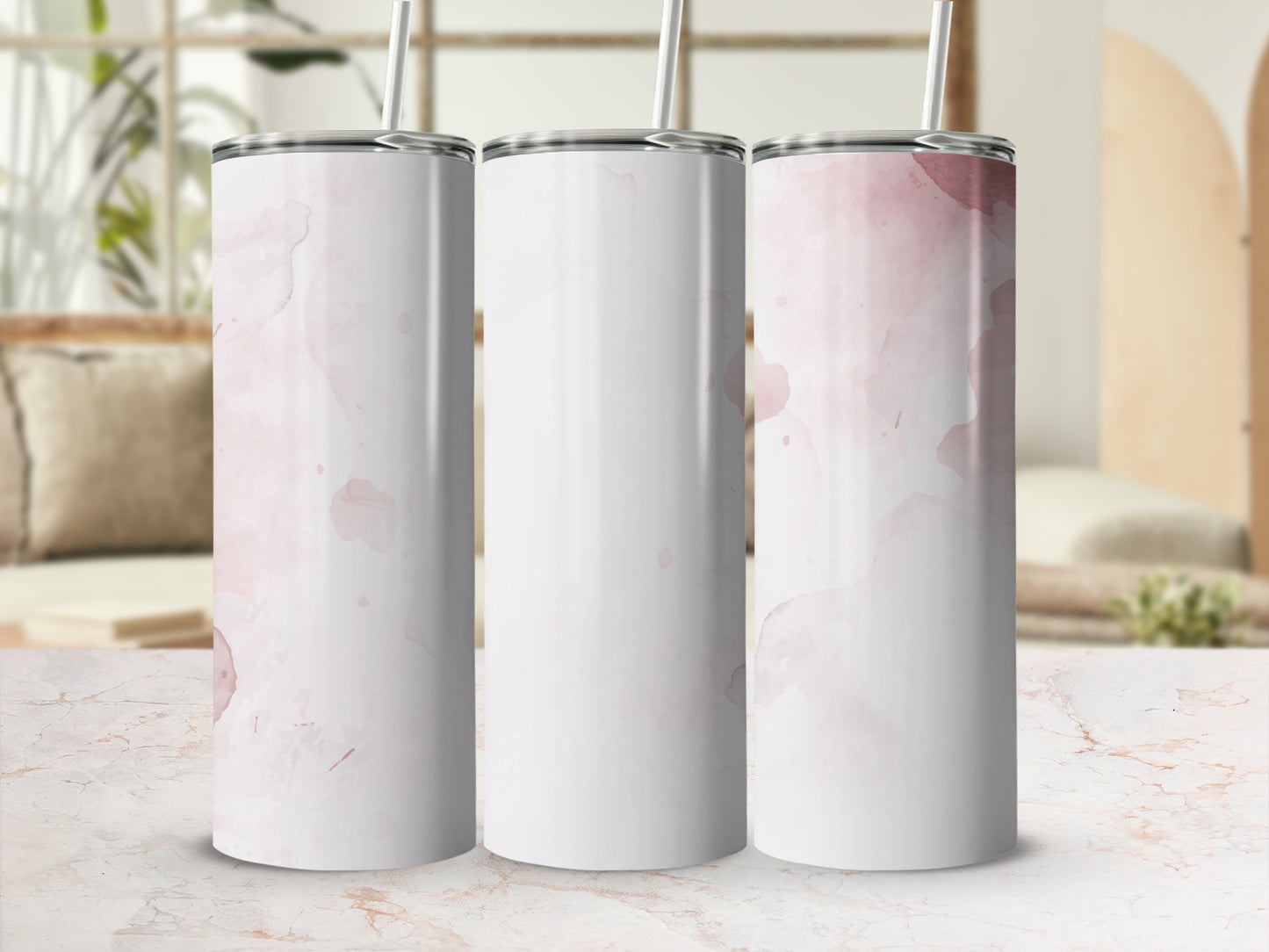 Three blank white tumblers with pink watercolor splotches.