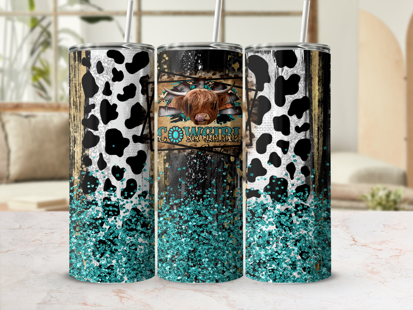 Cowgirl tumbler with cow print and turquoise glitter.