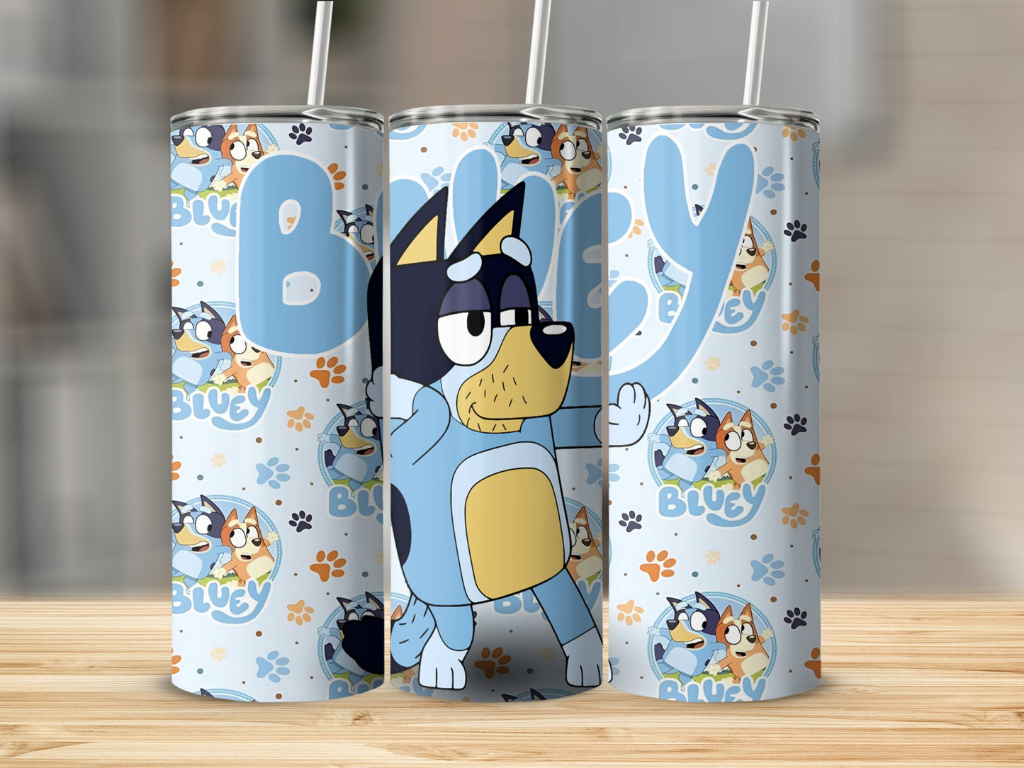 Bluey cartoon characters on a light blue tumbler with straw.