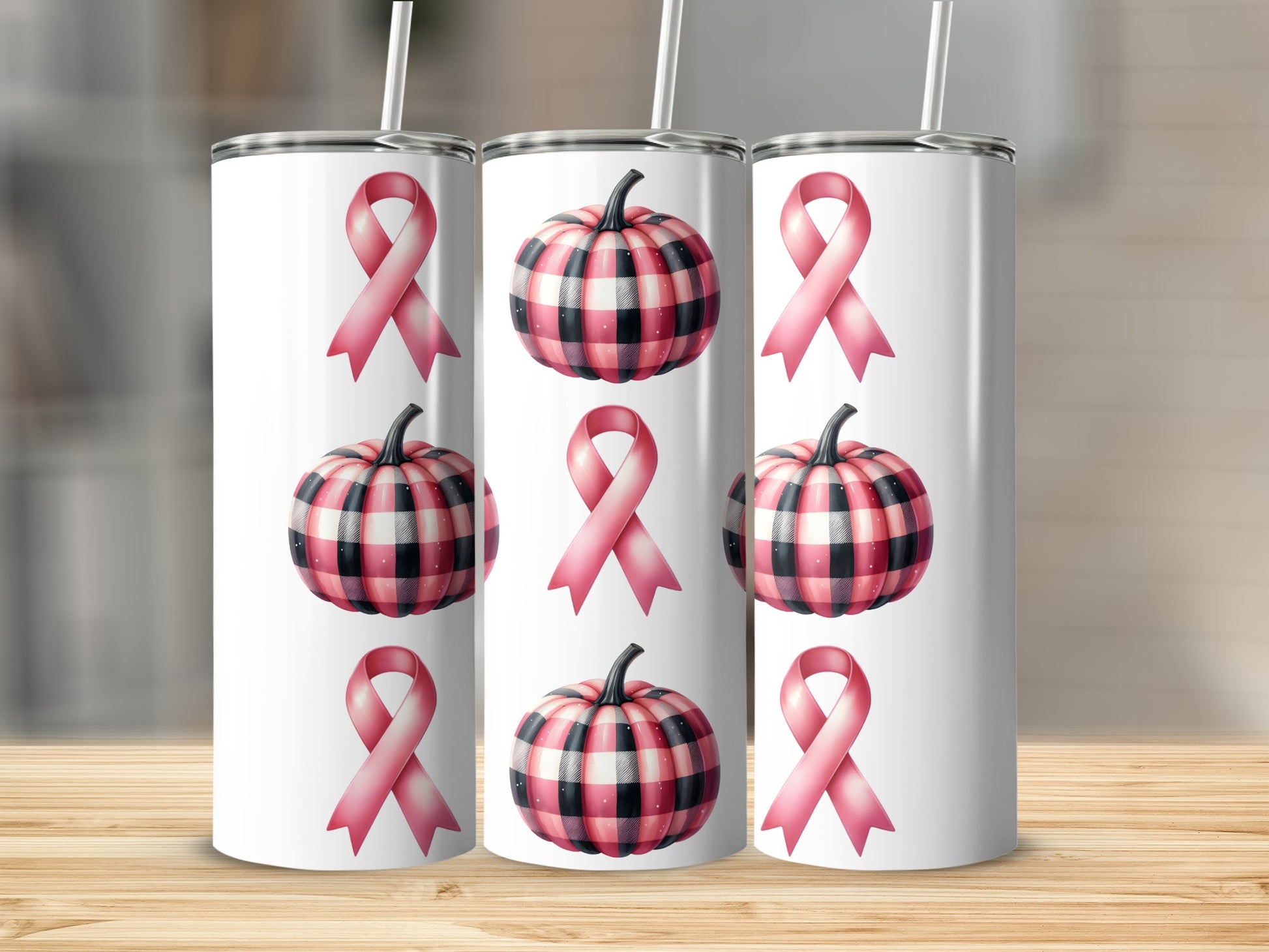 Three pink ribbon tumblers with plaid pumpkin designs.