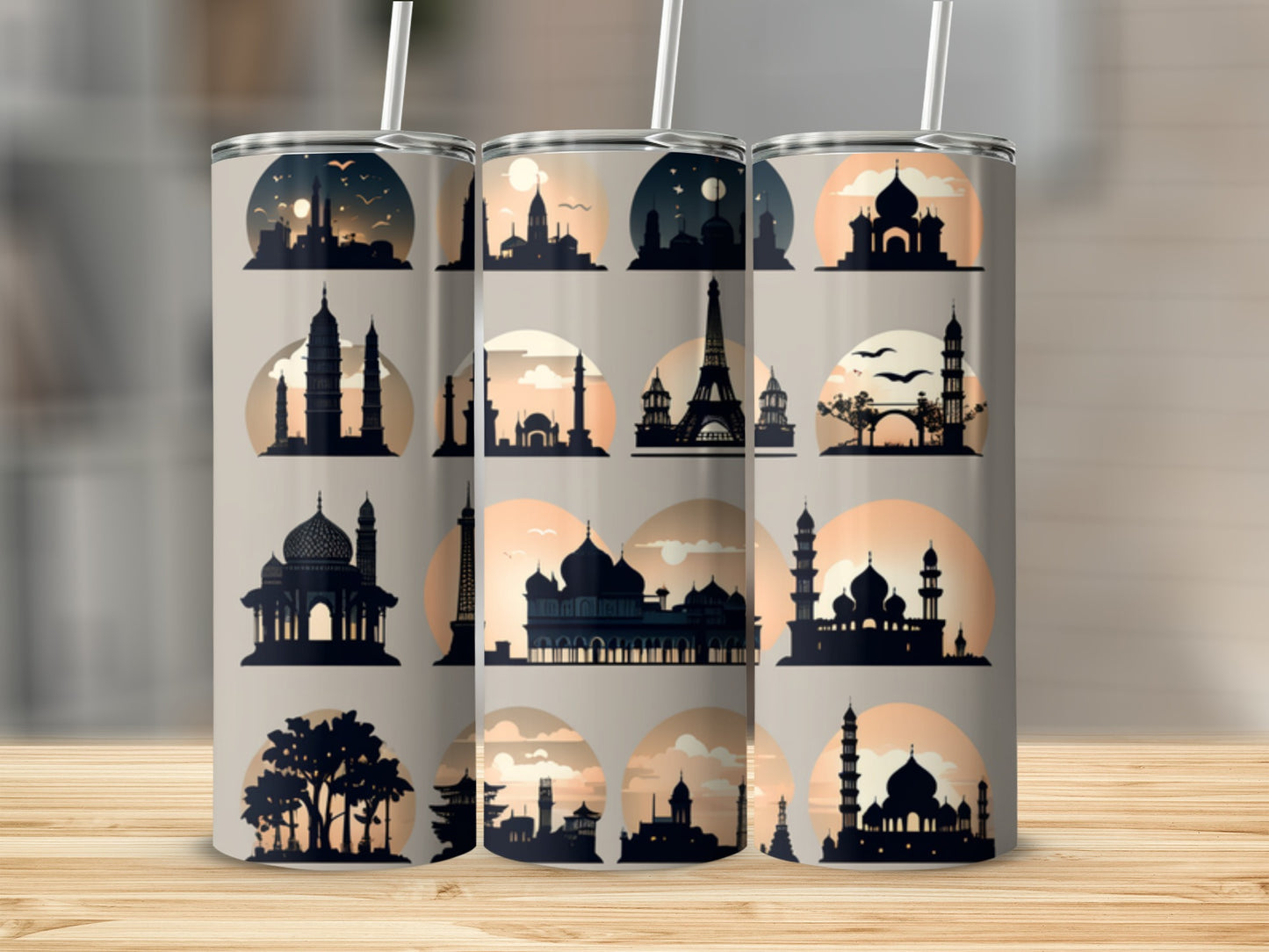 Silhouettes of famous landmarks and skylines on a set of three insulated tumblers.