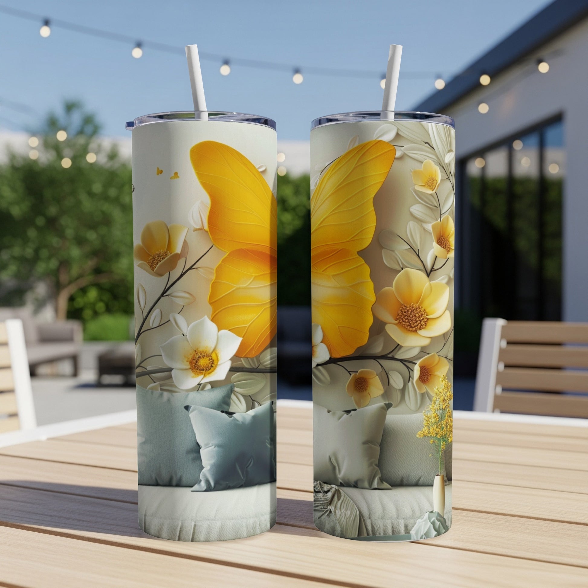 Two tumblers with a large yellow butterfly and floral design.