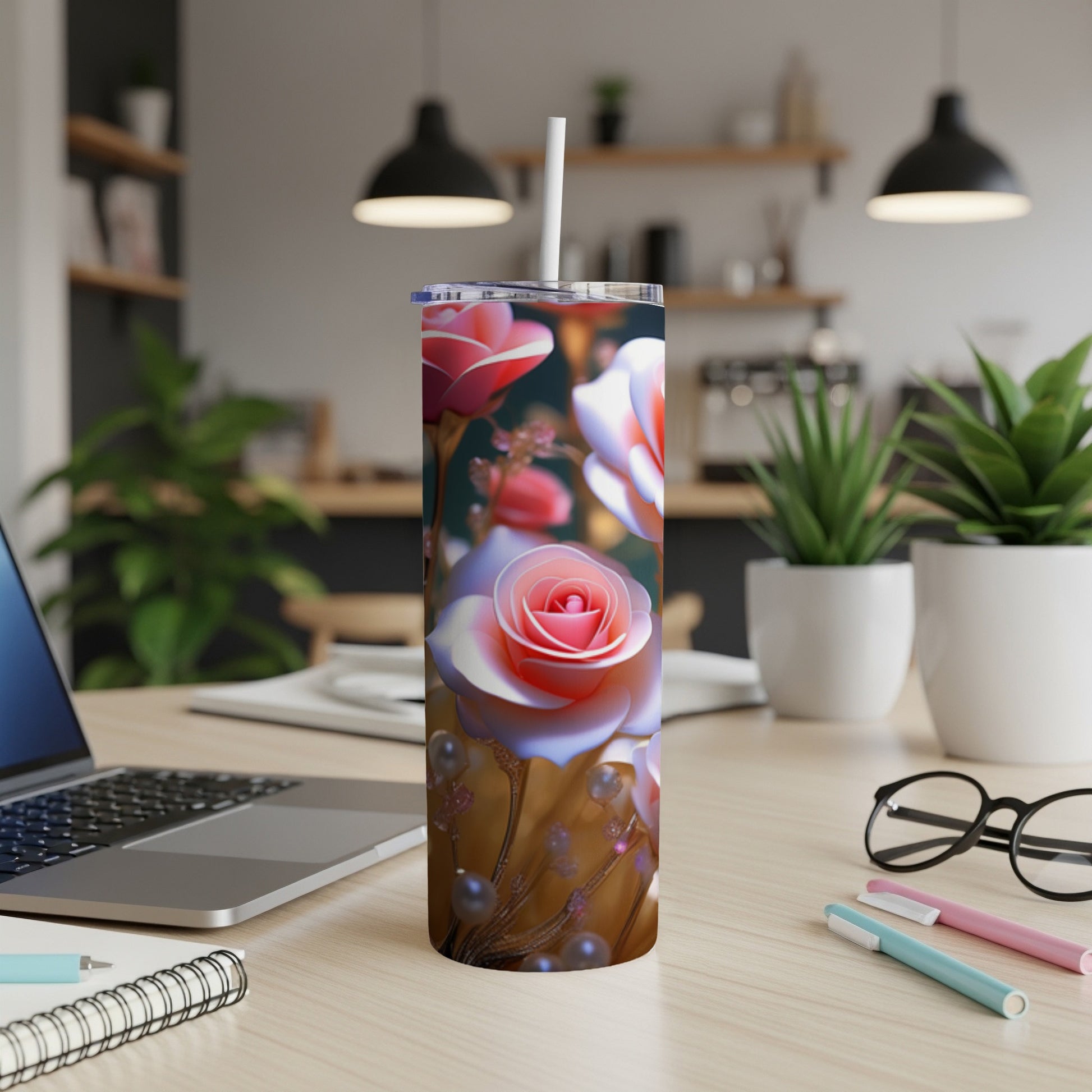 Pink and white roses adorn a tall, insulated tumbler with a straw.