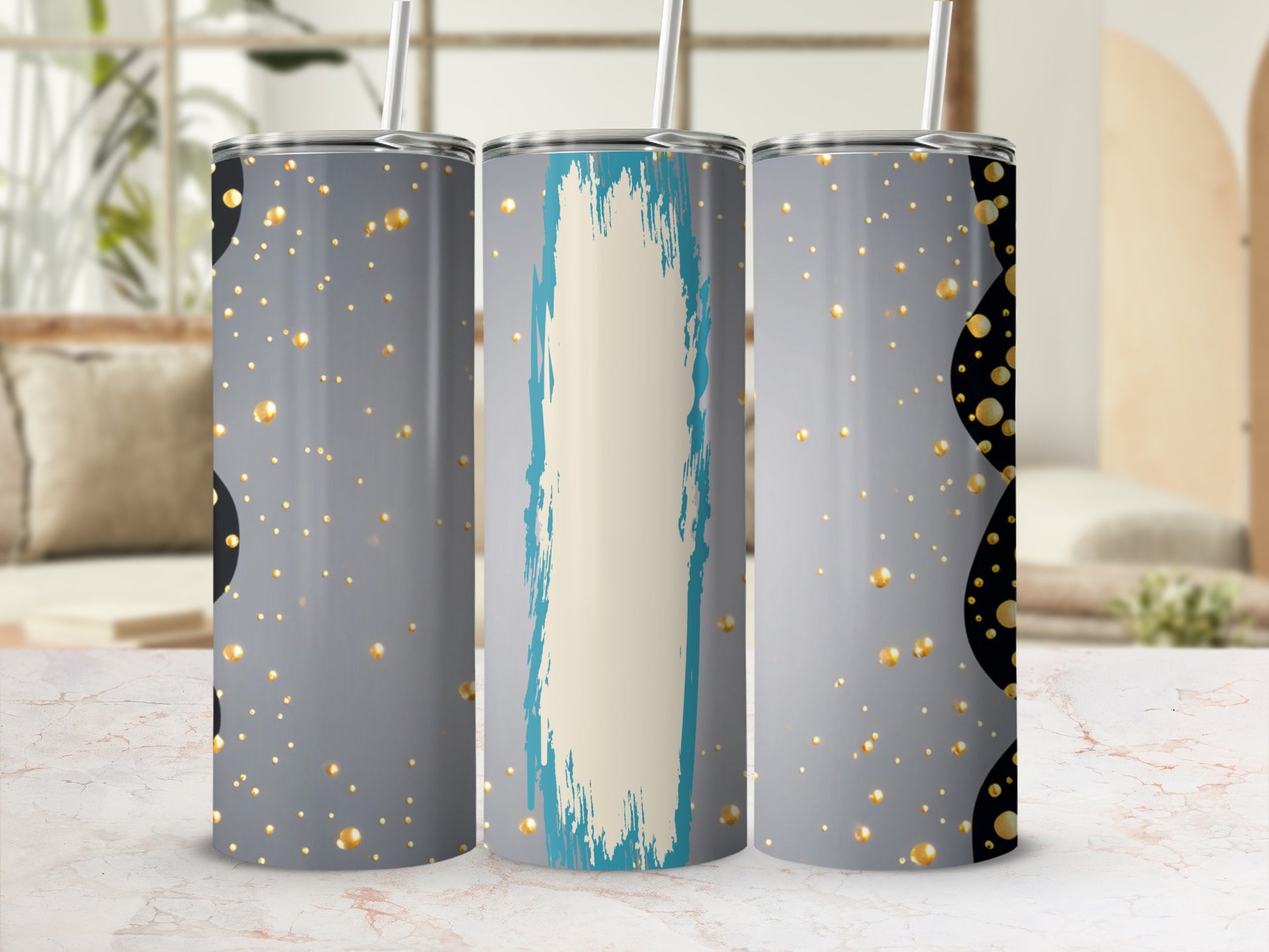Gray tumbler with gold circles and turquoise paint smear design.