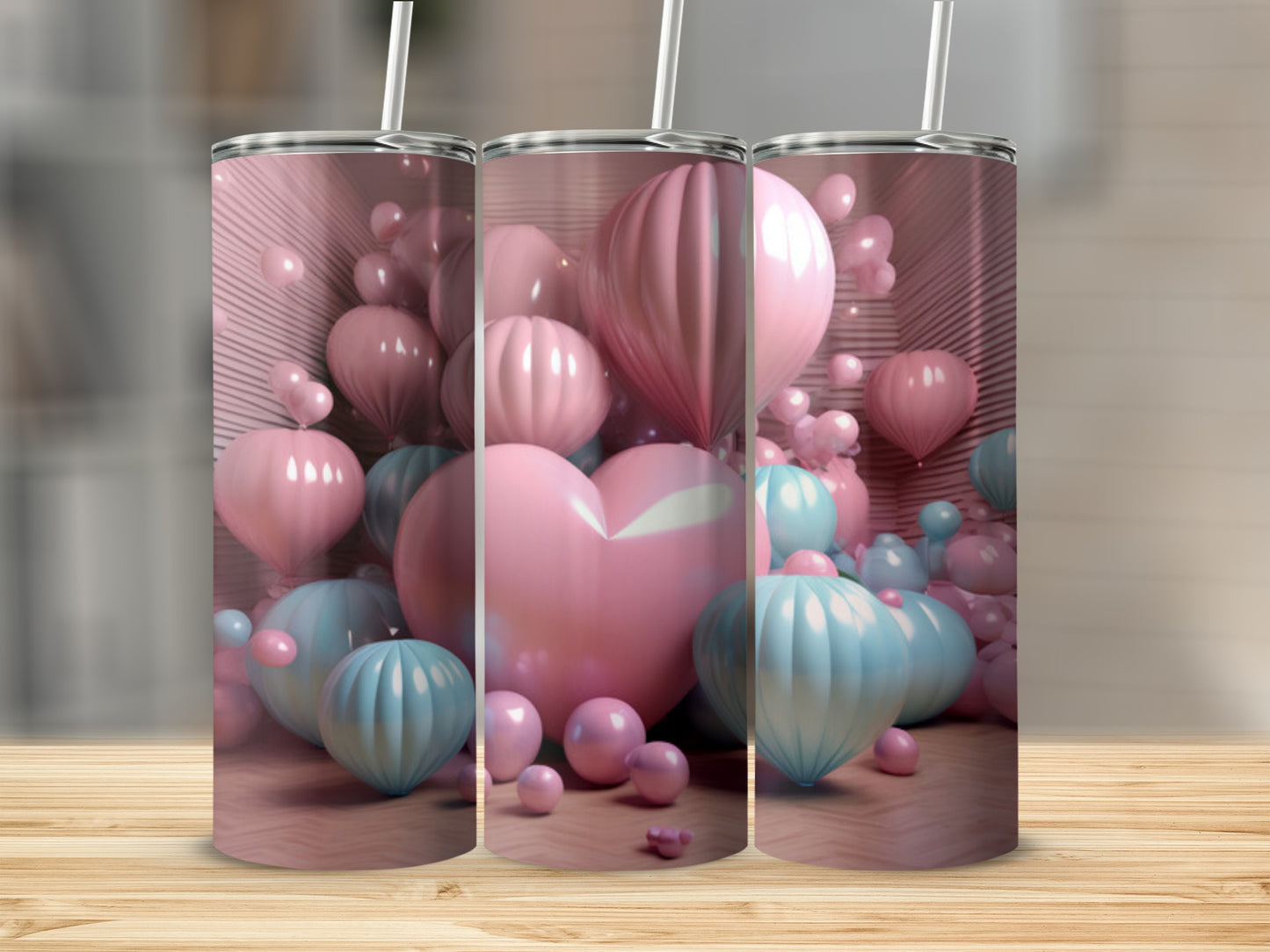 Three tall tumblers featuring a background of pink and blue balloons and a large pink heart.