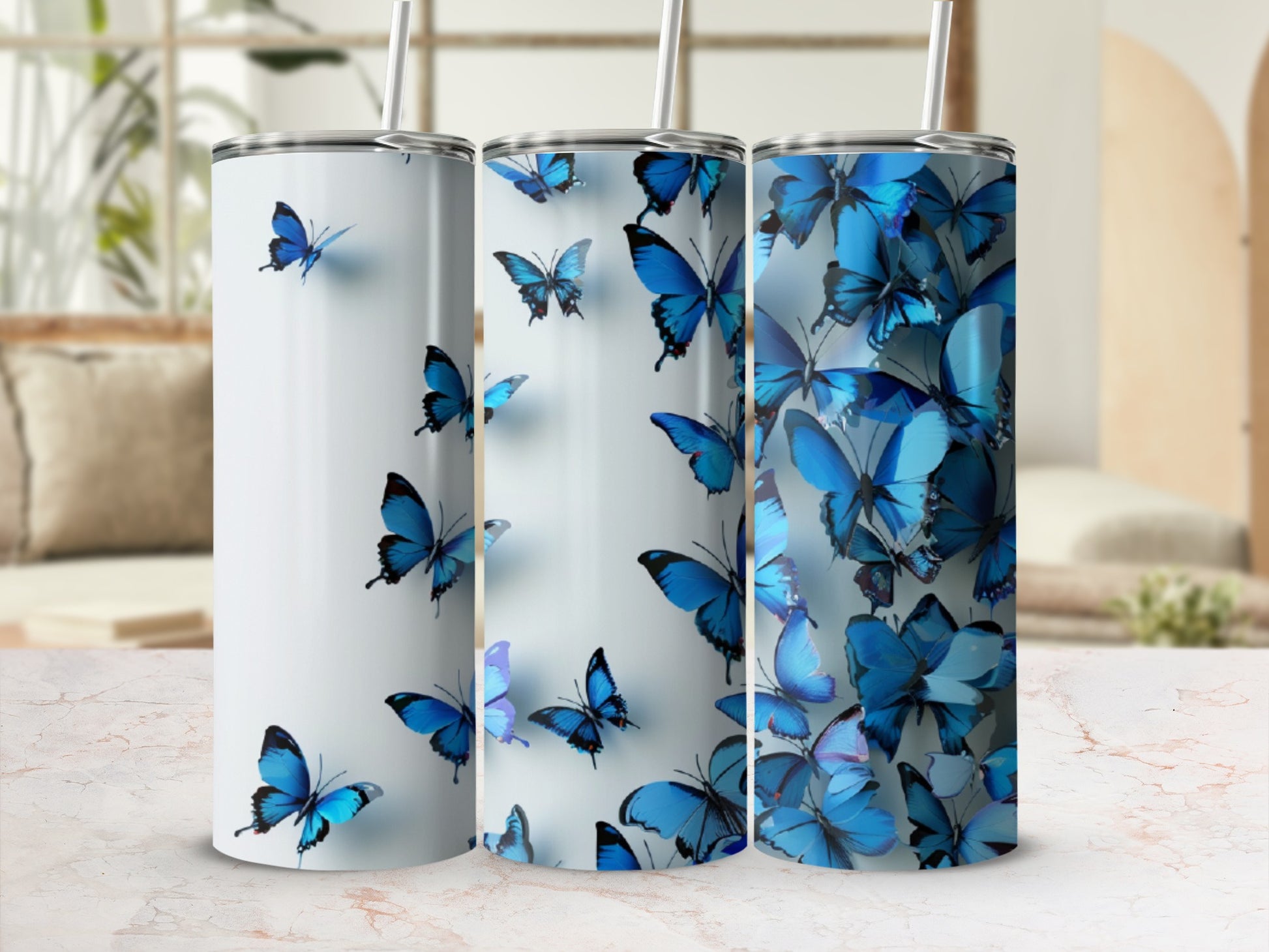 Three tall tumblers with a blue butterfly design.