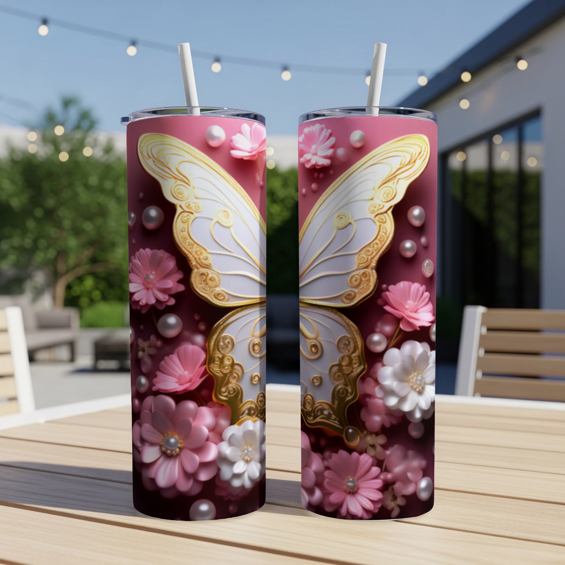 Two pink tumblers with white and gold butterfly wings and floral accents.
