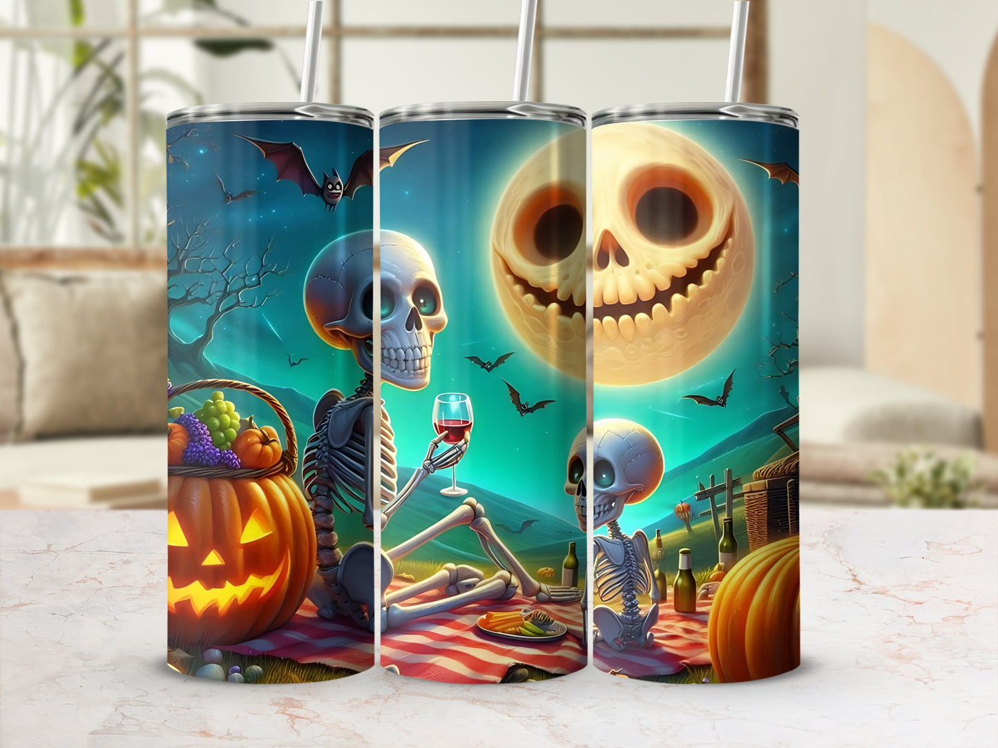 Three tumblers with Halloween skeletons, pumpkins, bats, and a smiling moon.