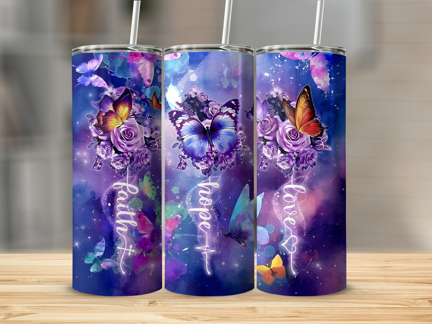 Three tumblers with butterflies, flowers, and inspirational text.