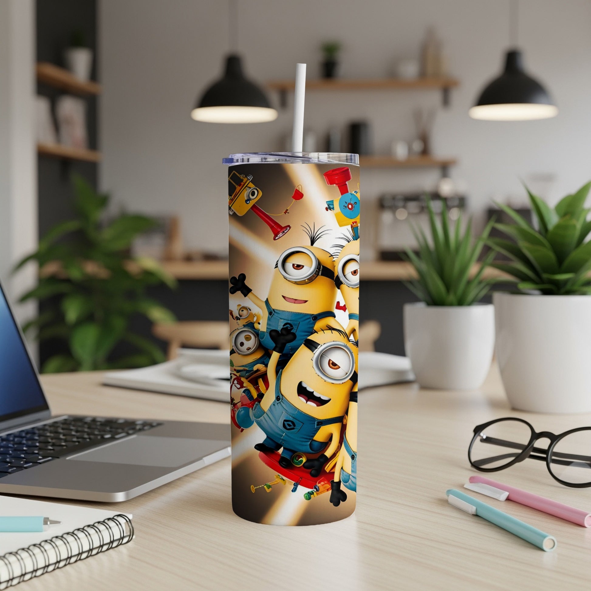 Minions graphic on a tall, skinny tumbler with a straw.