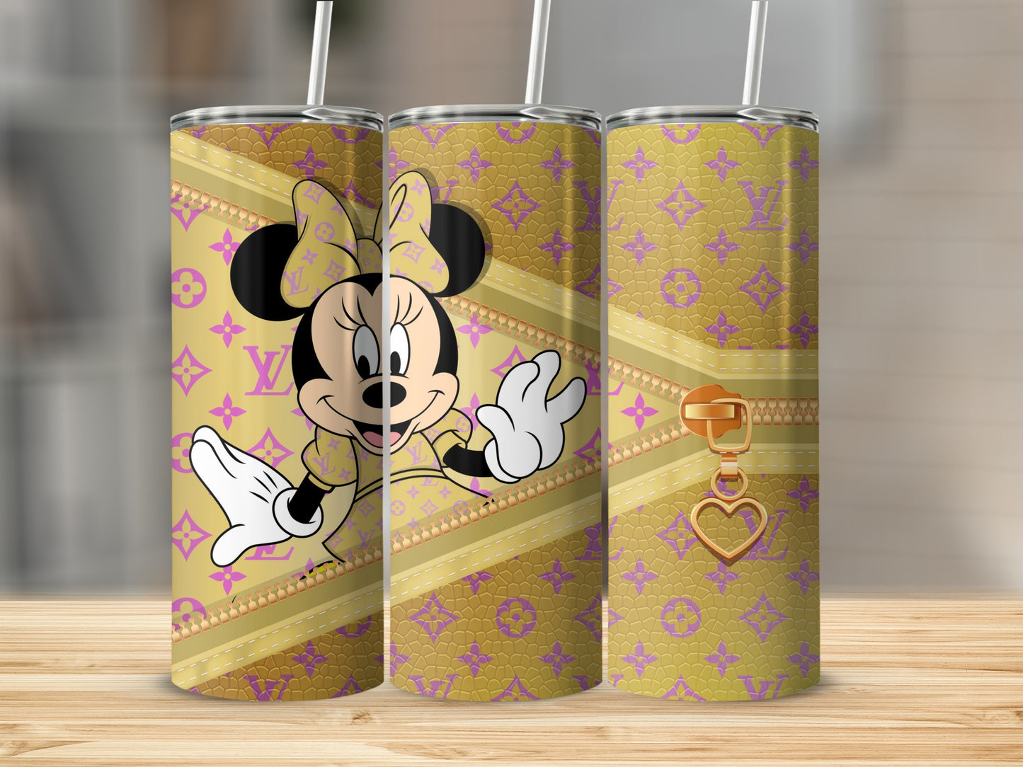 Minnie Mouse on a gold and purple patterned tumbler with a gold zipper.