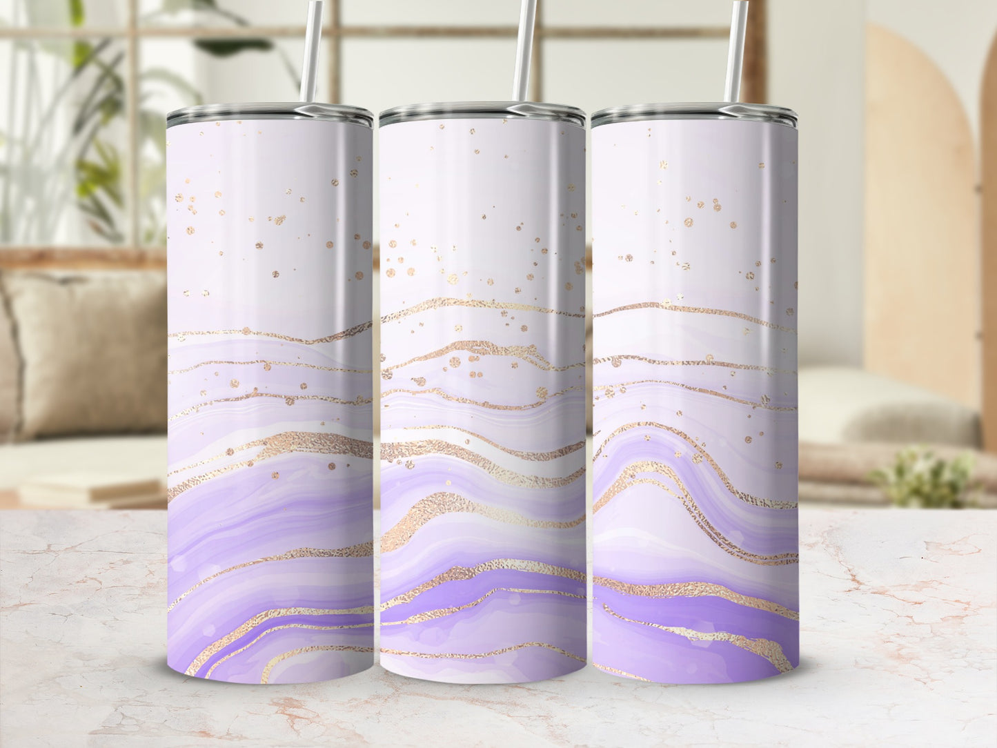 Three tumblers with purple and gold marble design and straws.