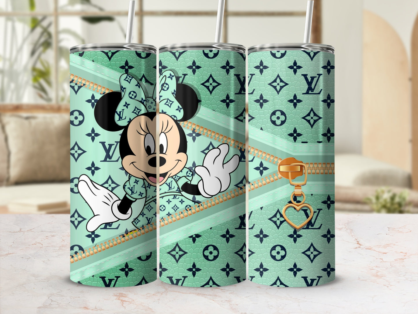Minnie Mouse on mint green tumbler with Louis Vuitton pattern and gold zipper detail.