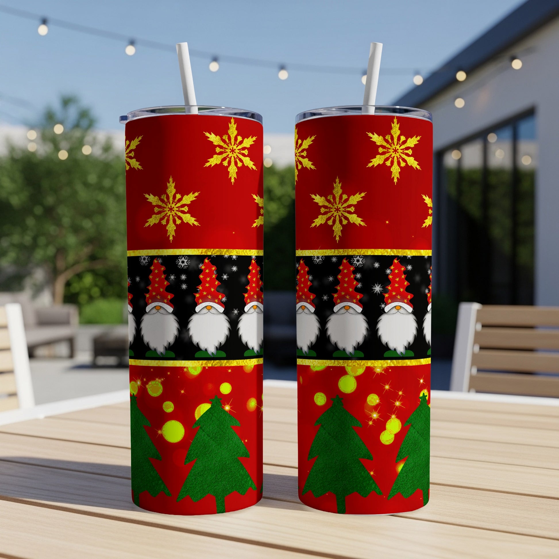 Two tumblers with Christmas gnomes, snowflakes, and trees.