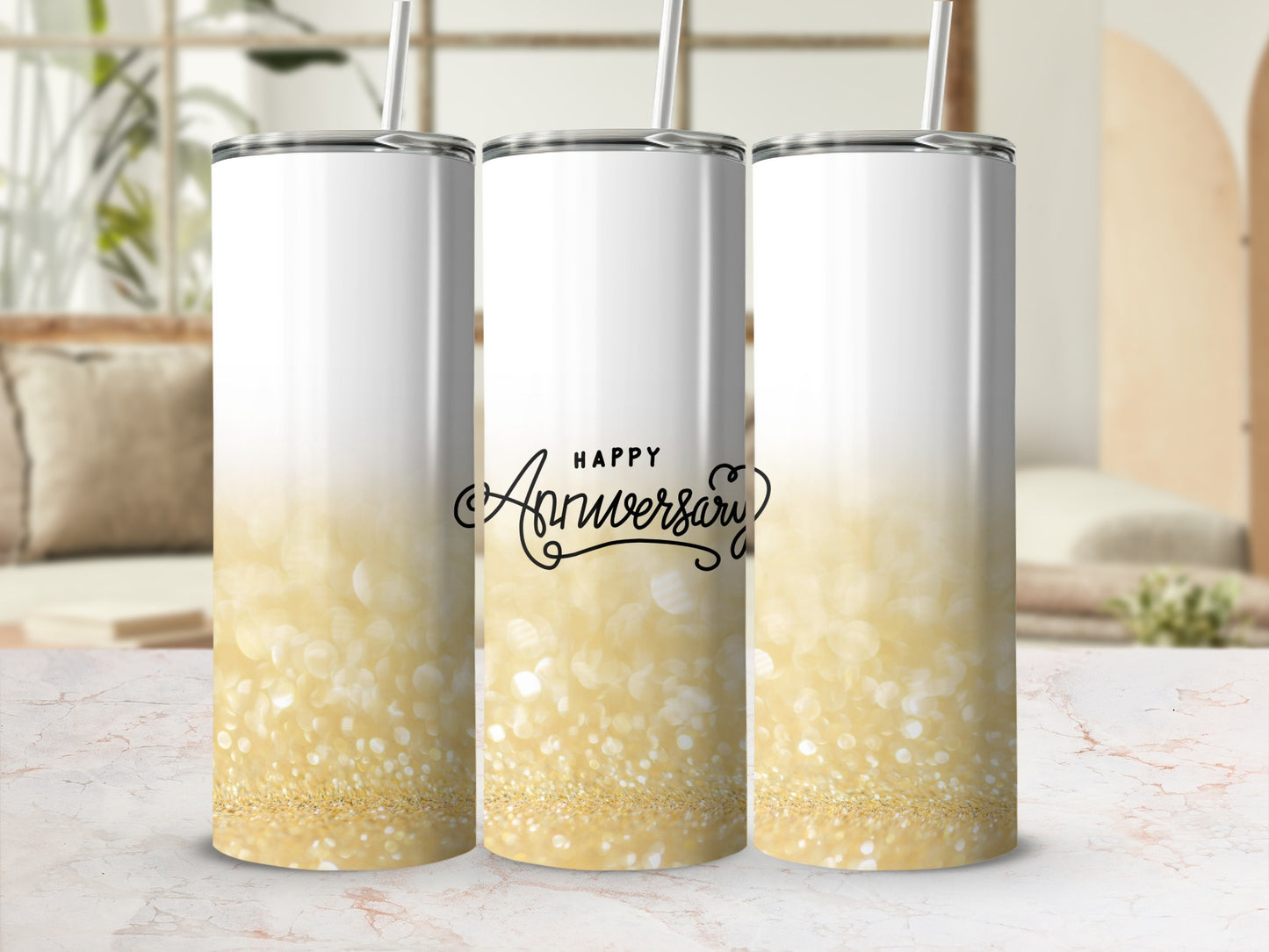 "Happy Anniversary" text on a gold glitter tumbler with a straw.