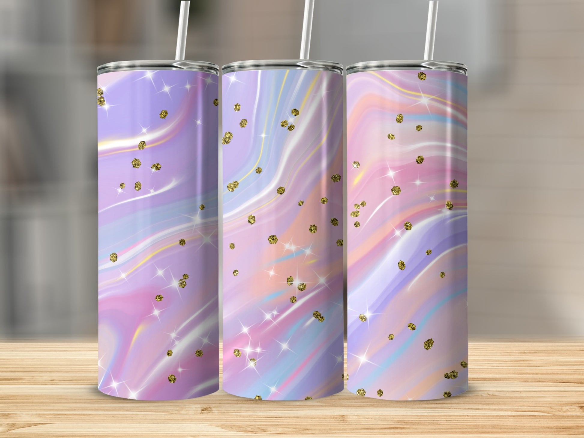 Three tumblers with pastel marble swirls and gold glitter accents.