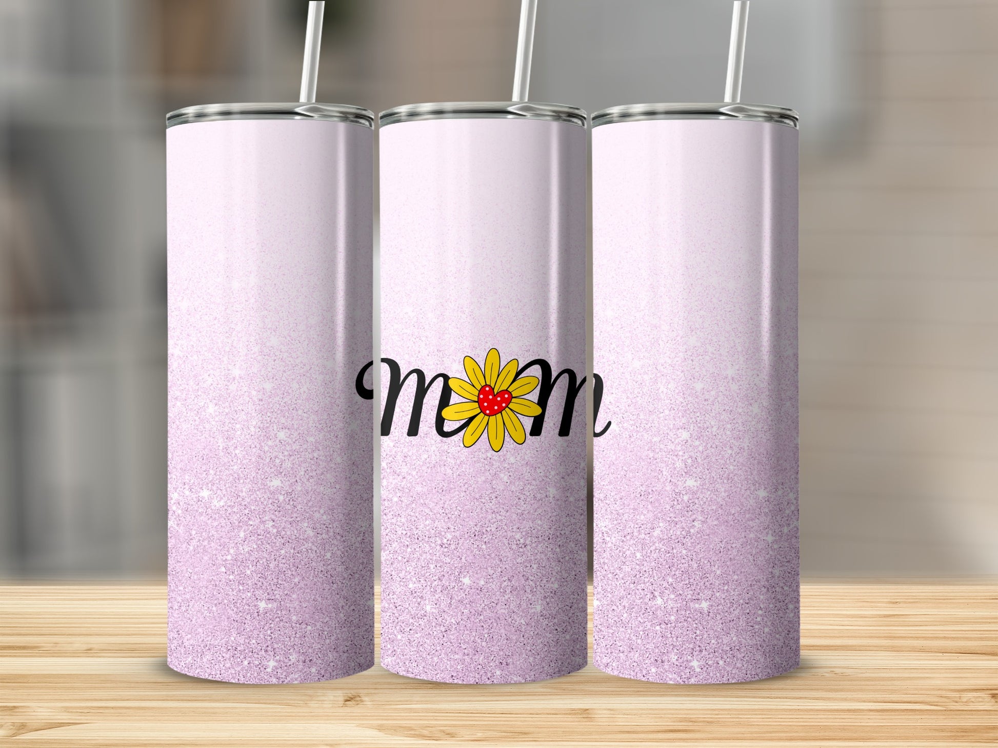 Pink glitter tumbler with "Mom" and a yellow flower design.