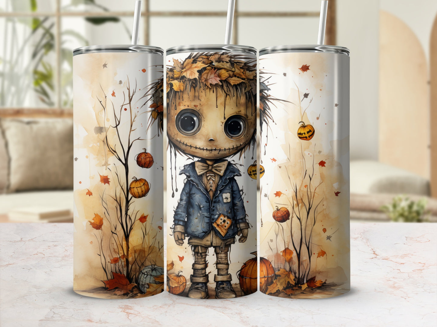 Three tumblers featuring a watercolor scarecrow with leaves, pumpkins, and bare branches.