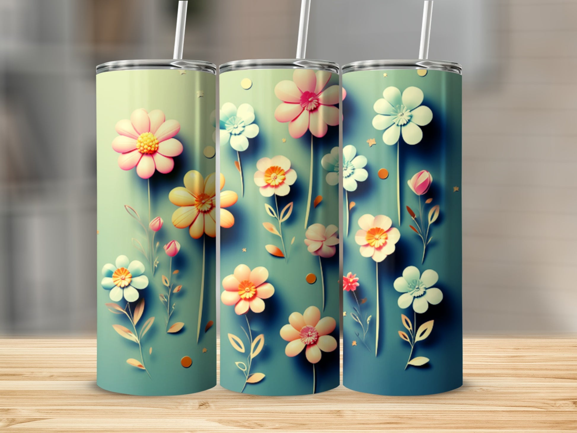 Three tumblers with pastel floral designs on a wooden surface.