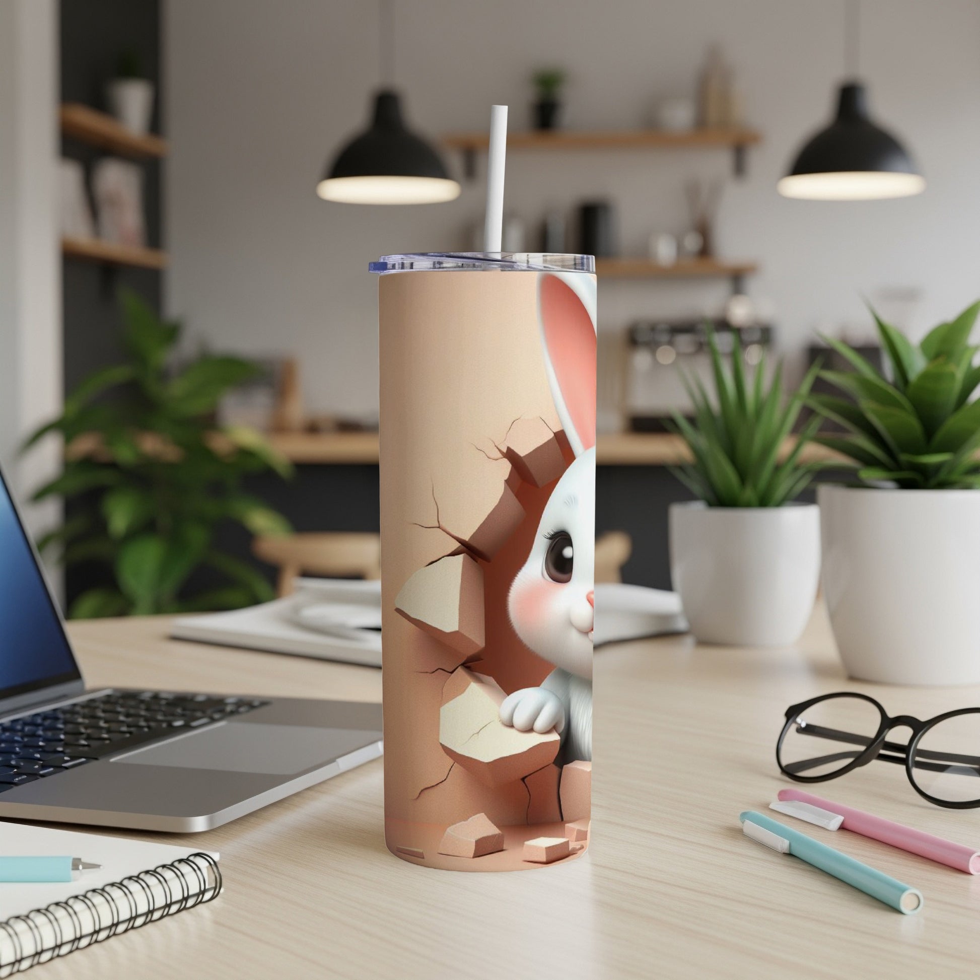 White bunny peeking through cracked beige background on a tumbler with straw.