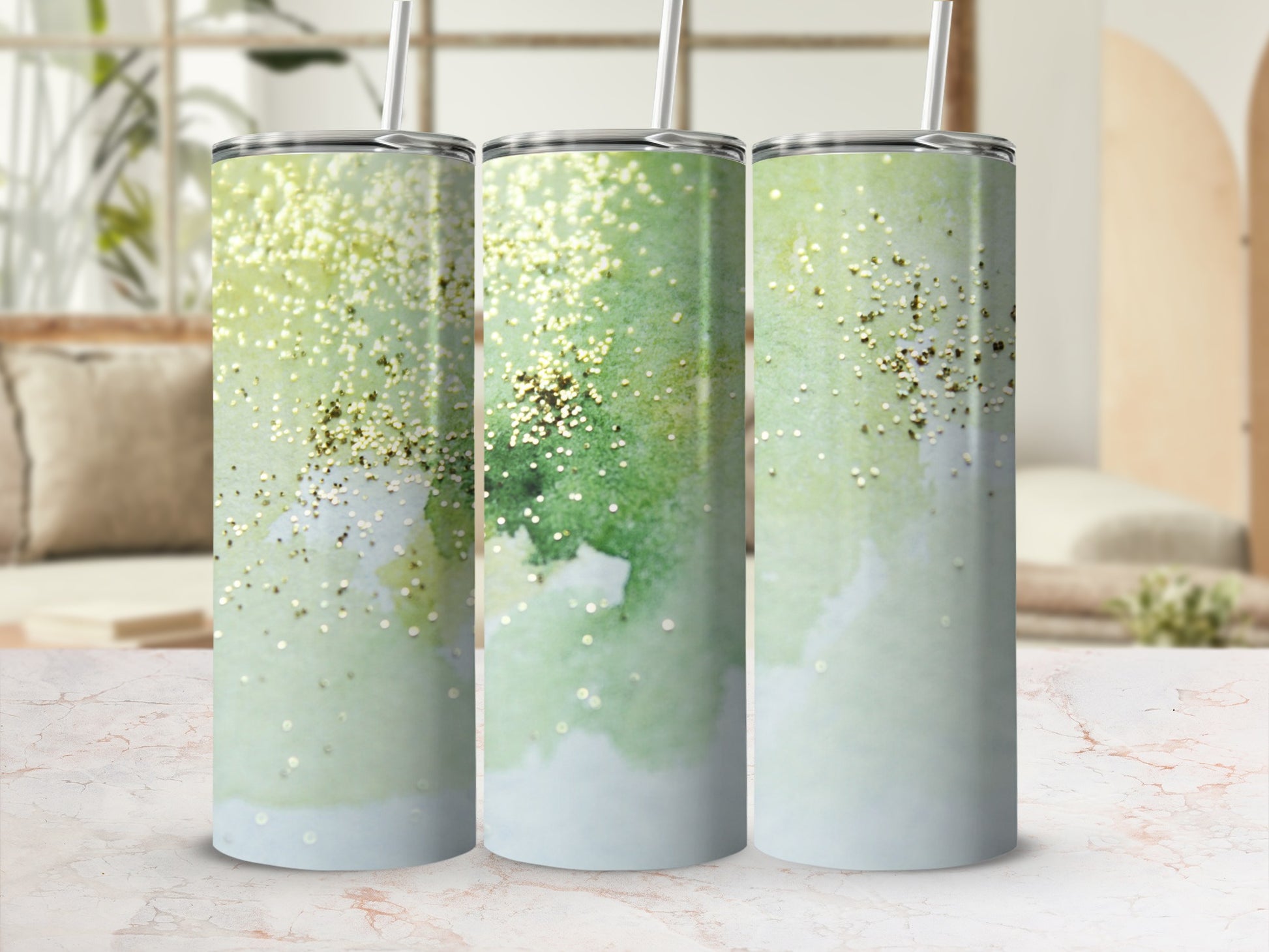 Three tumblers with a green watercolor and gold glitter design.