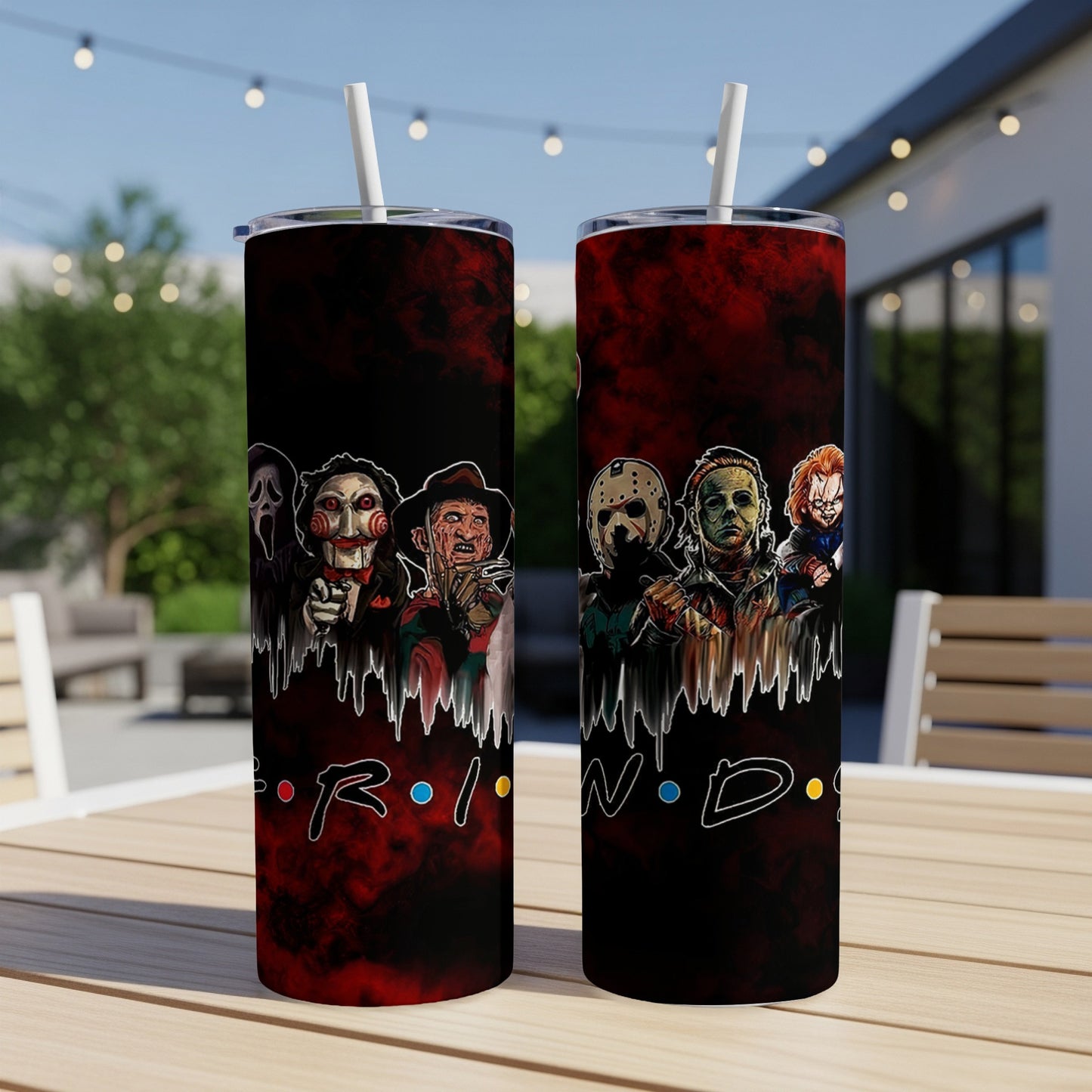 Two tumblers with horror movie characters and "FRIENDS" logo on a table.