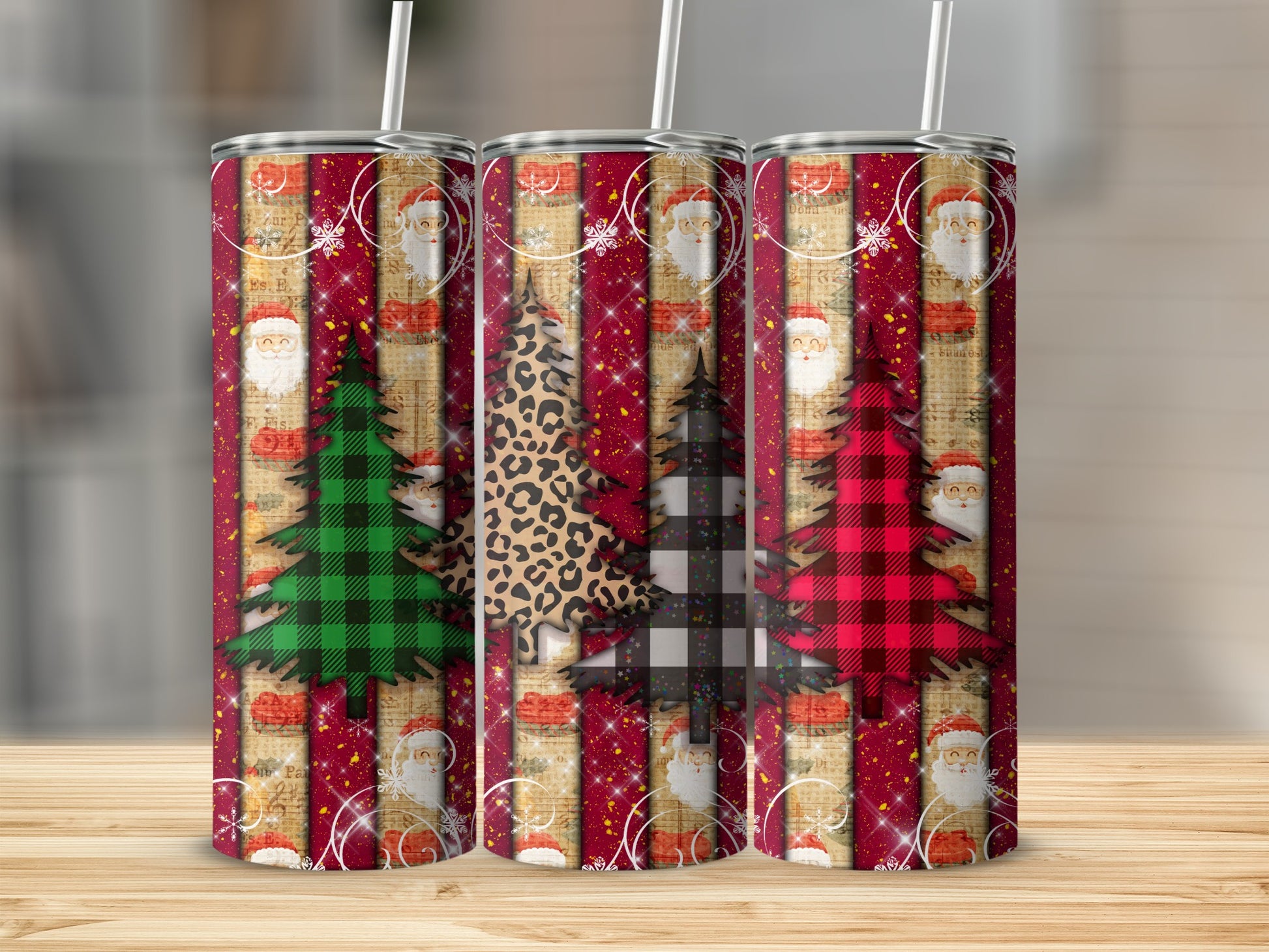 Three Christmas-themed tumblers with Santa, trees, and striped patterns.