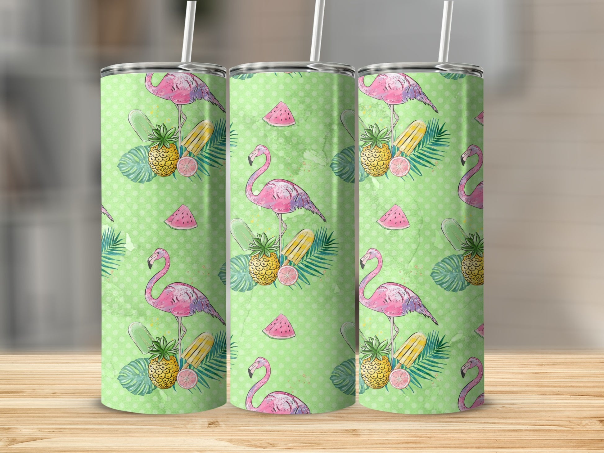 Three tumblers with a flamingo, pineapple, and watermelon pattern.