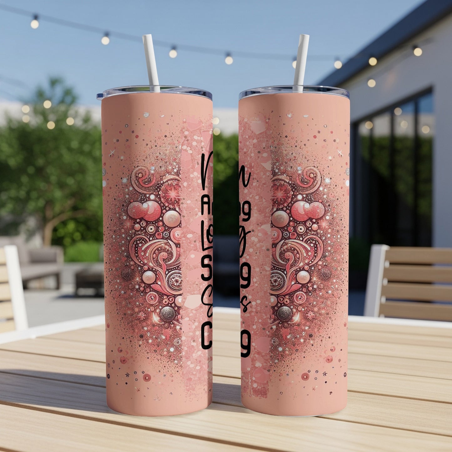 Pink tumbler with "Amazing Grace" text and ornate heart design.