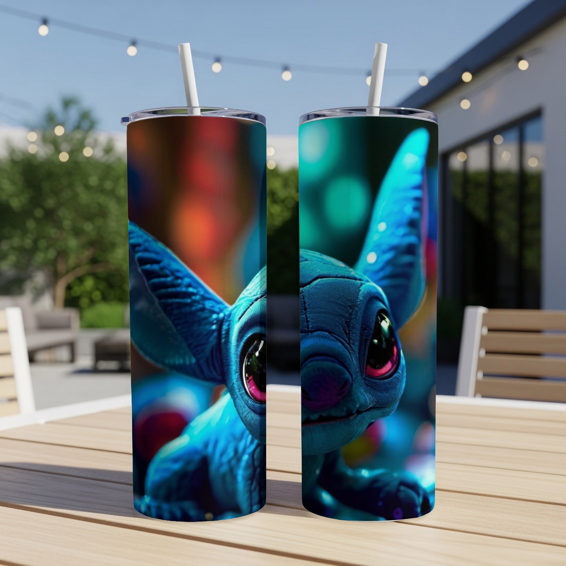 Two blue Stitch tumblers with straws on a wooden table.